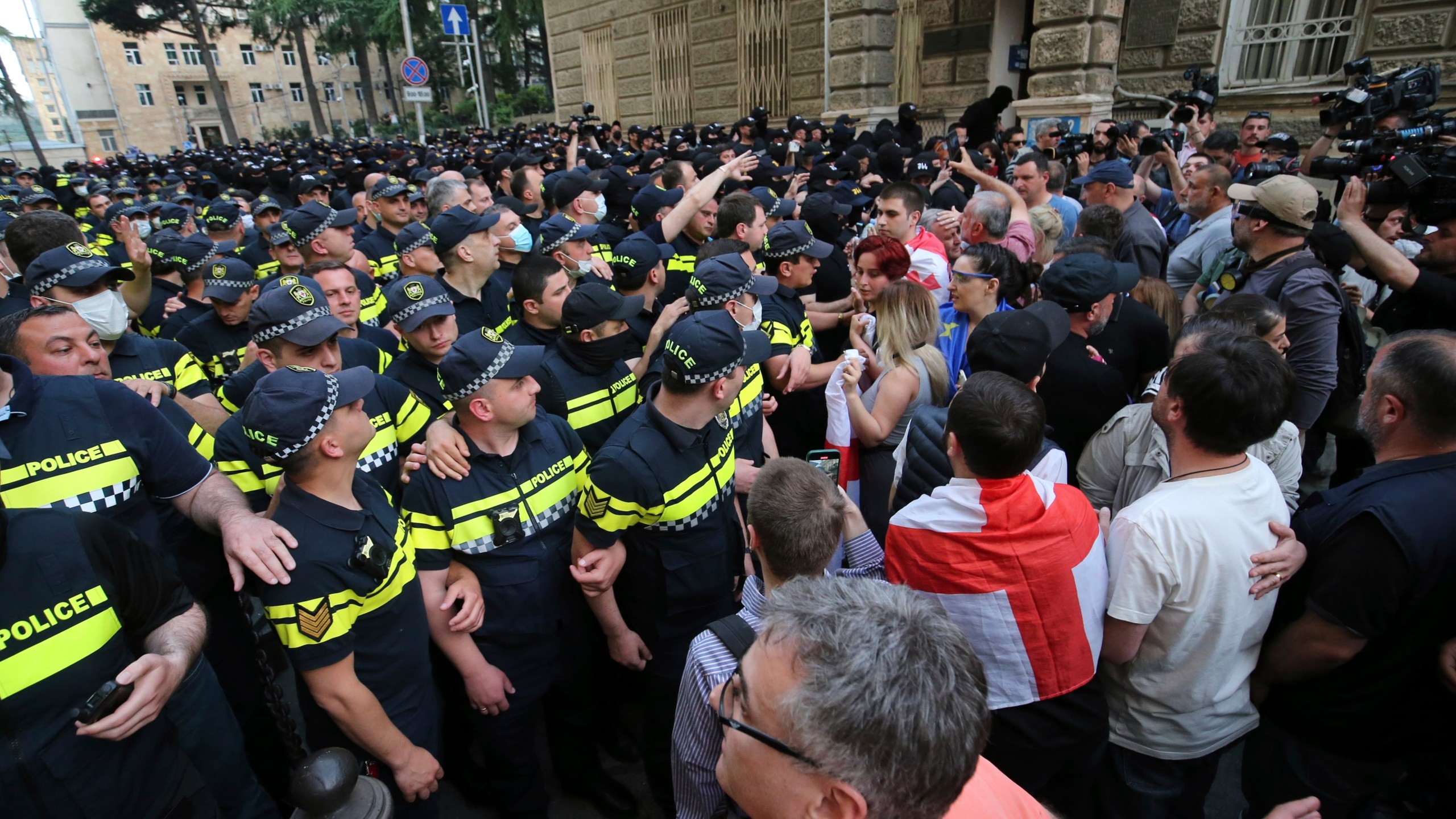 Police face demonstrators during an opposition protest against "the Russian law" near the Parliament building in Tbilisi, Georgia, on Wednesday, May 1, 2024. Protesters denounce the bill as "the Russian law" because Moscow uses similar legislation to stigmatize independent news media and organizations critical of the Kremlin. (AP Photo/Zurab Tsertsvadze)