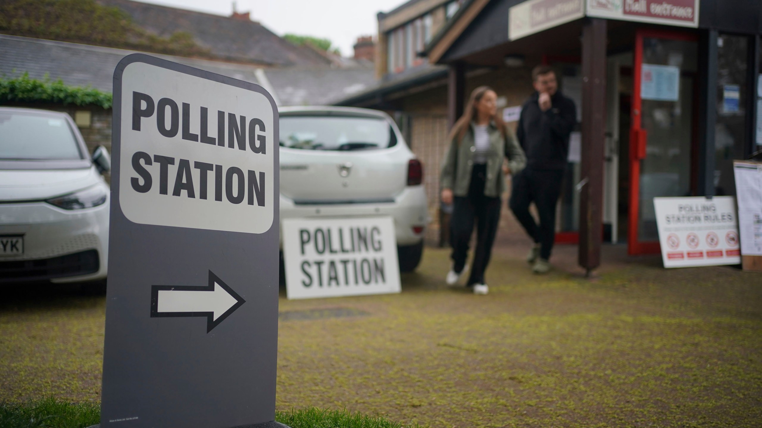 Voters leave a polling station at St Alban's Church, south London, after casting their votes in the local and London Mayoral election Thursday, May 2, 2024. (Yui Mok/PA via AP)