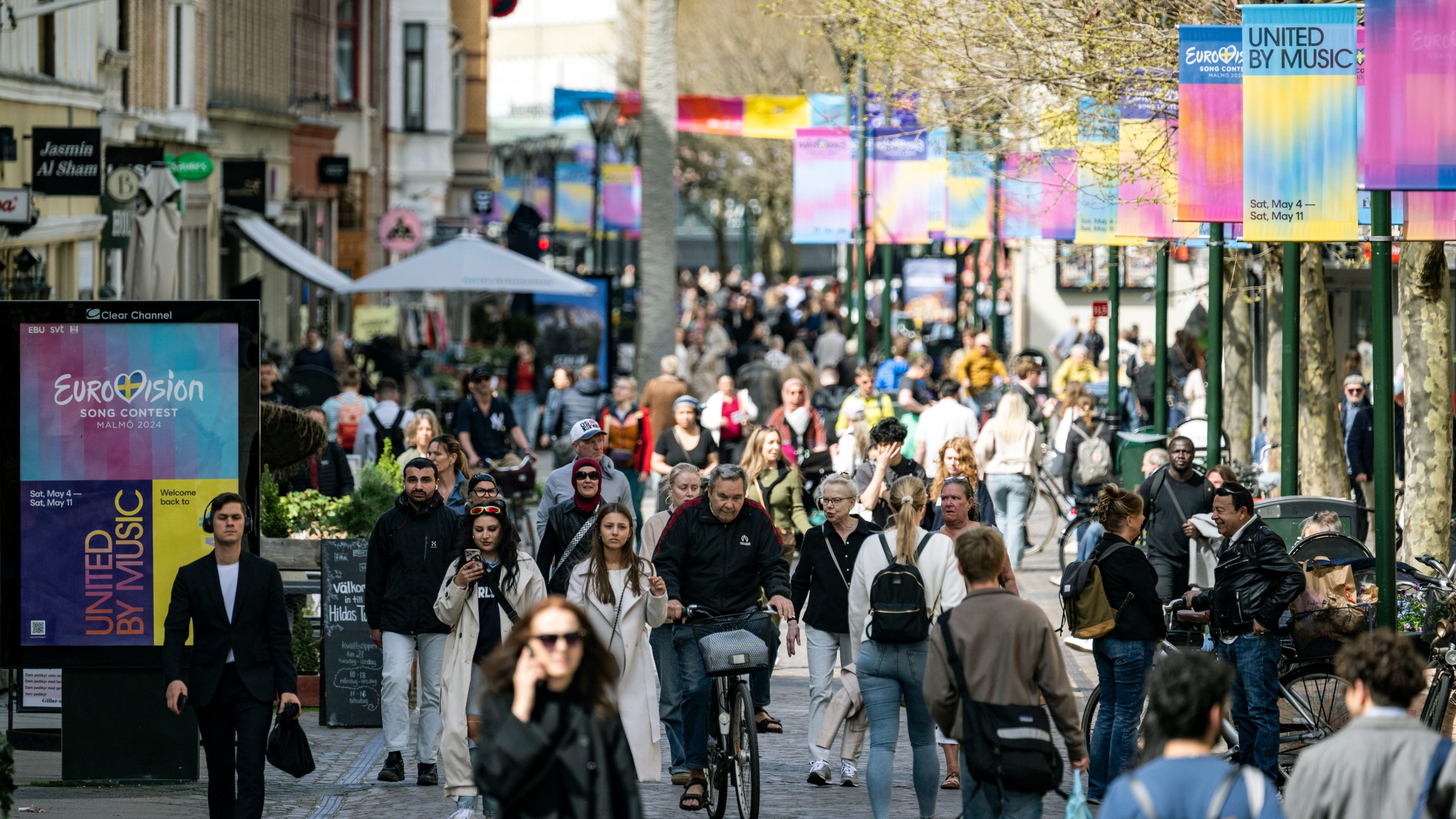 People walk along the Eurovision signposted pedestrian street Södra Förstadsgatan in central Malmö, Sweden, Tuesday, April 30, 2024. (Johan Nilsson/TT News Agency via AP)