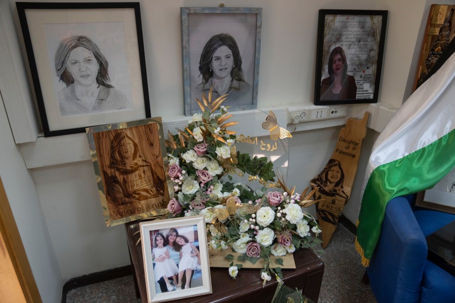 A corner is dedicated for late Al Jazeera network journalist Shireen Abu Akleh inside the network's office, in the West Bank city of Ramallah Sunday, May 5, 2024. Israel ordered the local offices of Qatar's Al Jazeera satellite news network to close Sunday, escalating a long-running feud between the broadcaster and Prime Minister Benjamin Netanyahu's hard-line government as Doha-mediated cease-fire negotiations with Hamas hang in the balance. (AP Photo/Nasser Nasser)