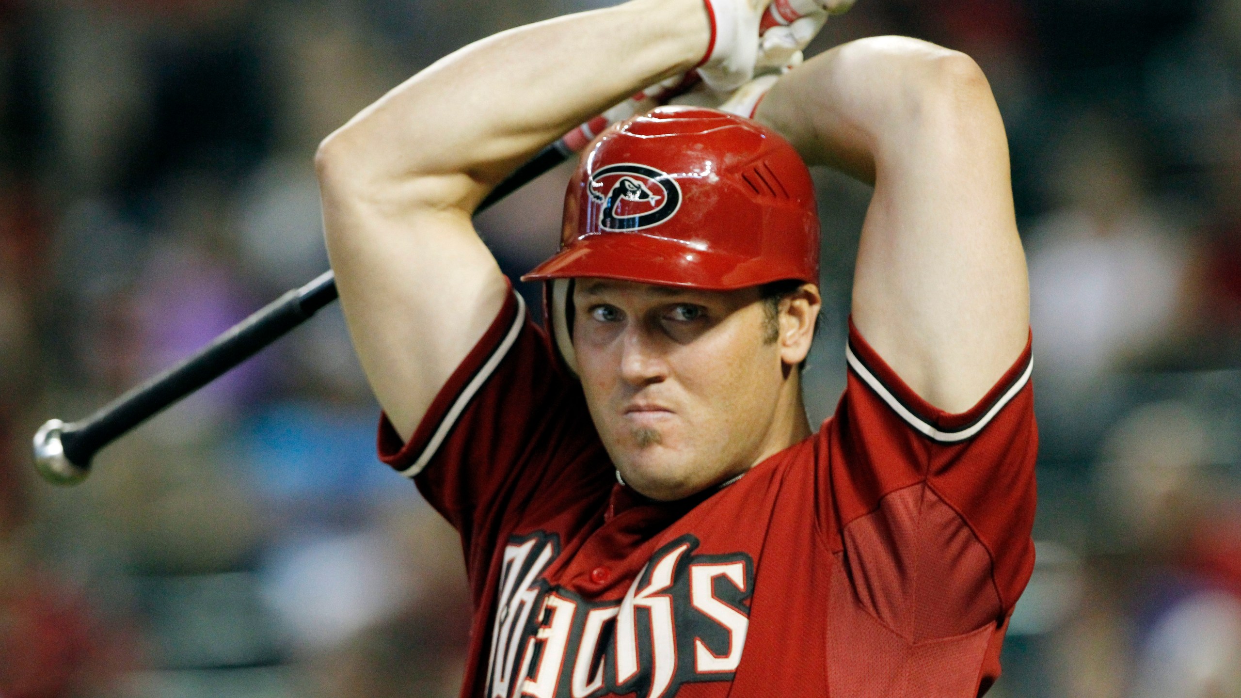 FILE - Arizona Diamondbacks' Sean Burroughs warms up prior to batting during a baseball game against the New York Mets, Sunday, Aug. 14, 2011, in Phoenix. Burroughs, a two-time Little League World Series champion who won an Olympic gold medal and went on to a major league career that was interrupted by substance abuse, has died. He was 43. The Los Angeles County Medical Examiner’s online records said Burroughs died Thursday, May 9, 2024, with the cause of death deferred. (AP Photo/Ross D. Franklin, File)