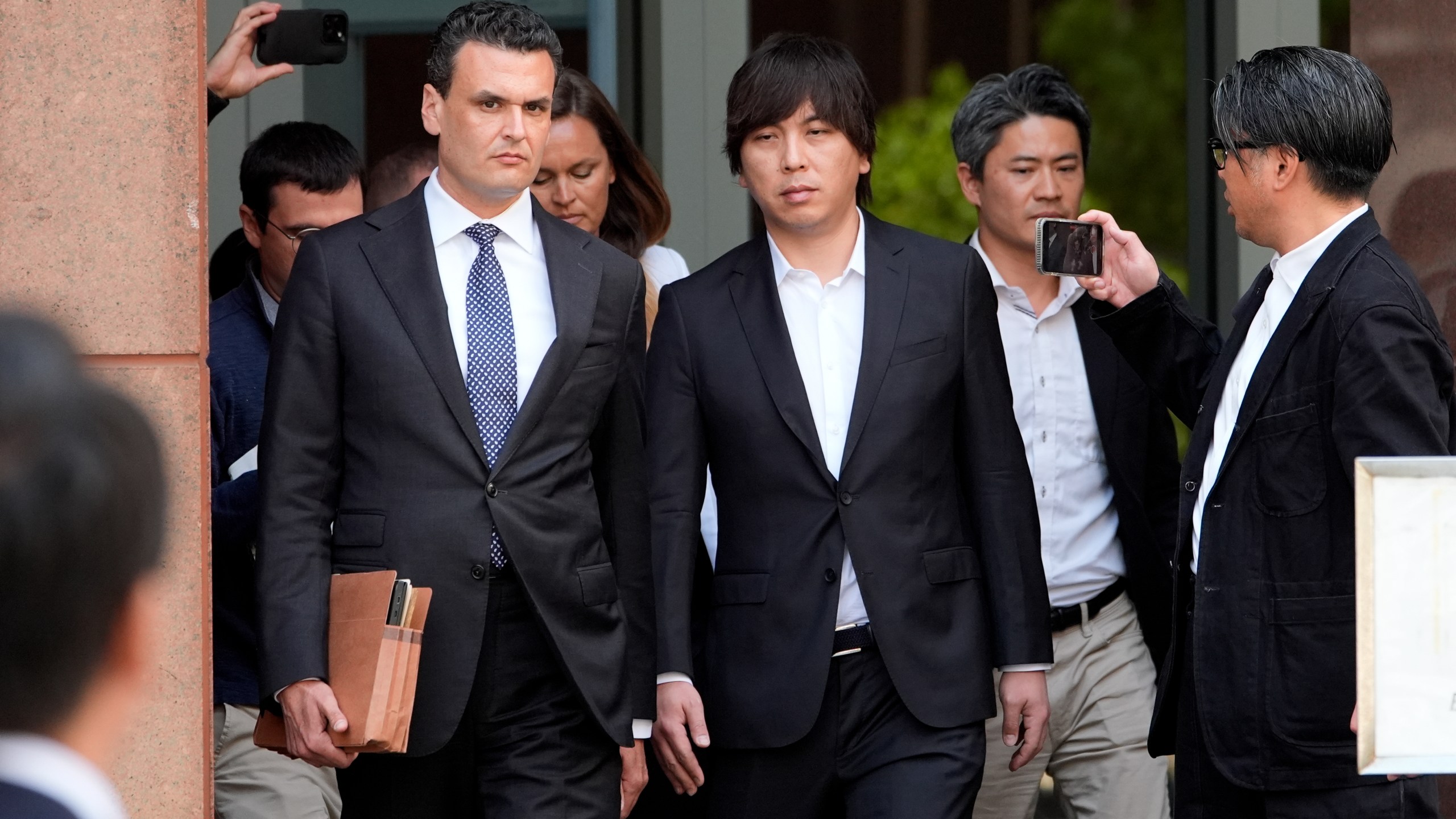 Ippei Mizuhara, the former longtime interpreter for the Los Angeles Dodgers baseball star Shohei Ohtani, leaves federal court following his arraignment, Tuesday, May 14, 2024 in Los Angeles. (AP Photo/Damian Dovarganes)