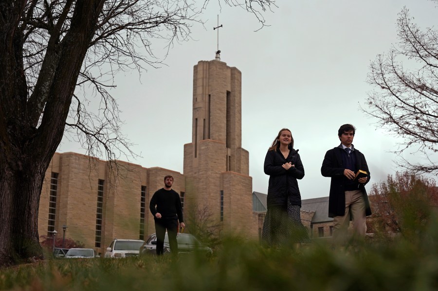 Students leave after attending a Catholic Mass at Benedictine College Sunday, Dec. 3, 2023, in Atchison, Kan. Students told The Associated Press in interviews they embrace the college's emphasis on Catholic teaching and practice. (AP Photo/Charlie Riedel)