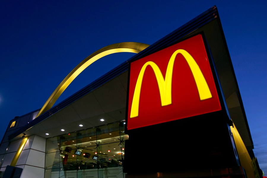 FILE - The McDonald's restaurant logo and golden arch is lit up, April 20, 2006, in Chicago. McDonald’s plans to introduce a $5 meal deal in the U.S. in June 2024 to counter slowing sales and customers’ frustration with high prices. (AP Photo/Jeff Roberson, File)