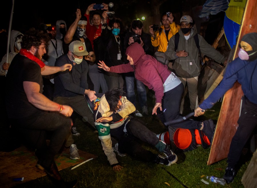 FILE - Demonstrators clash at an encampment at UCLA early Wednesday, May 1, 2024, in Los Angeles. The police chief at the University of California, Los Angeles, has been reassigned amid criticism of his handling of campus demonstrations. (AP Photo/Ethan Swope, File)