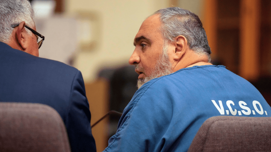 Attorney Ron Bamieh, left, listens to his client, Loay Abdelfattah Alnaji, a professor of computer science at Moorpark College, in Ventura County Superior Court on Nov. 17, 2023, in Ventura.