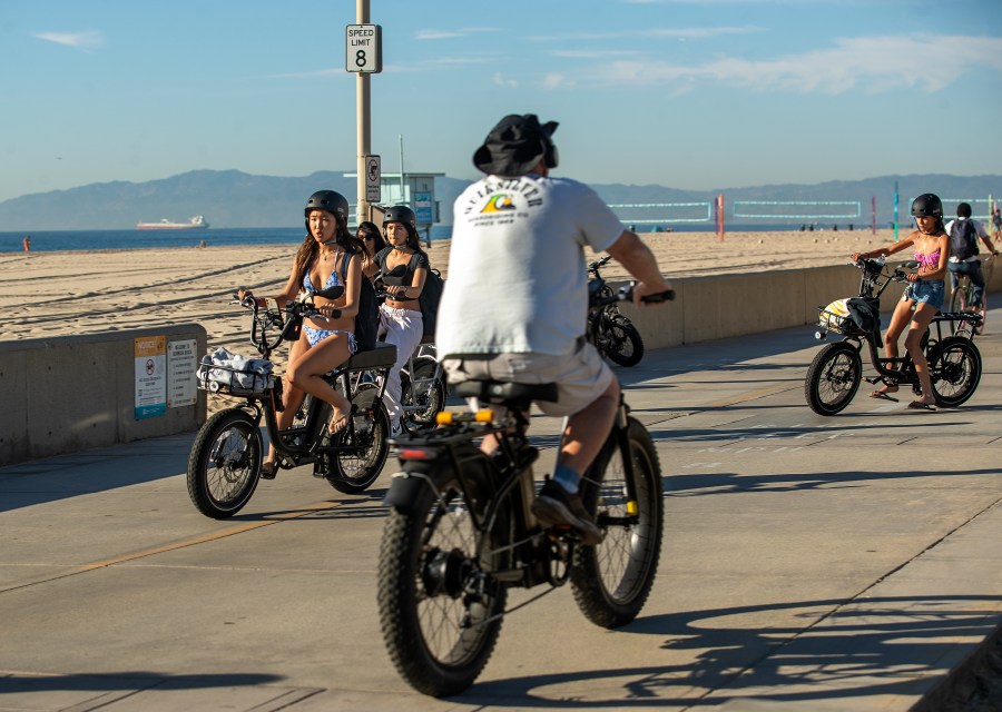 HERMOSA BEACH, CA-NOVEMBER 10, 2023, 2023:People ride their e-bikes on the Strand in Hermosa Beach. In Hermosa Beach, it's against city code to use electric power on the Strand, but many e-bike riders do so anyway.  (Mel Melcon / Los Angeles Times via Getty Images)