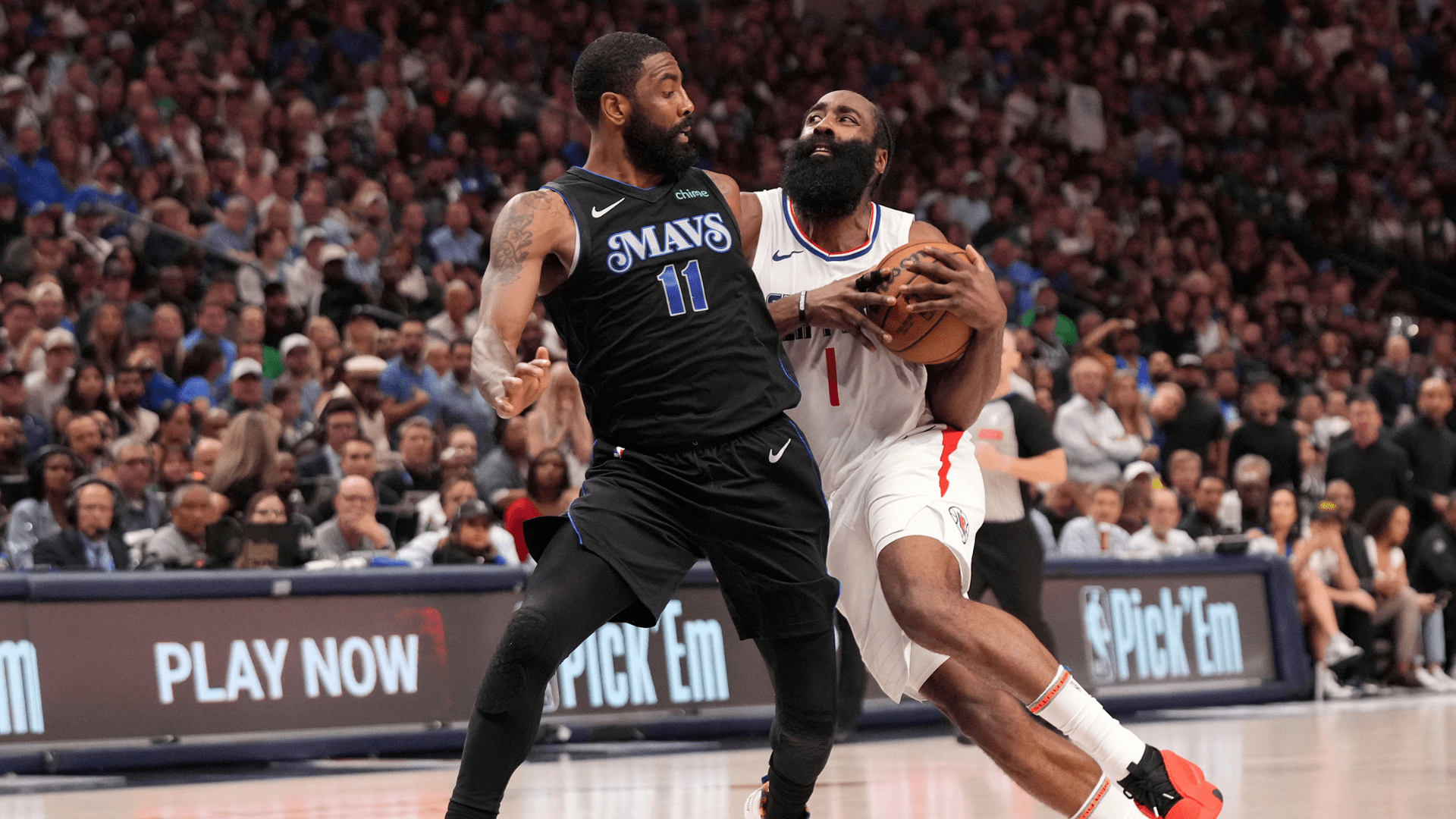 Los Angeles Clippers guard James Harden (1) drives against Dallas Mavericks guard Kyrie Irving (11) during the first half of Game 6 of an NBA basketball first-round playoff series Friday, May 3, 2024, in Dallas. (AP Photo/Jeffrey McWhorter)