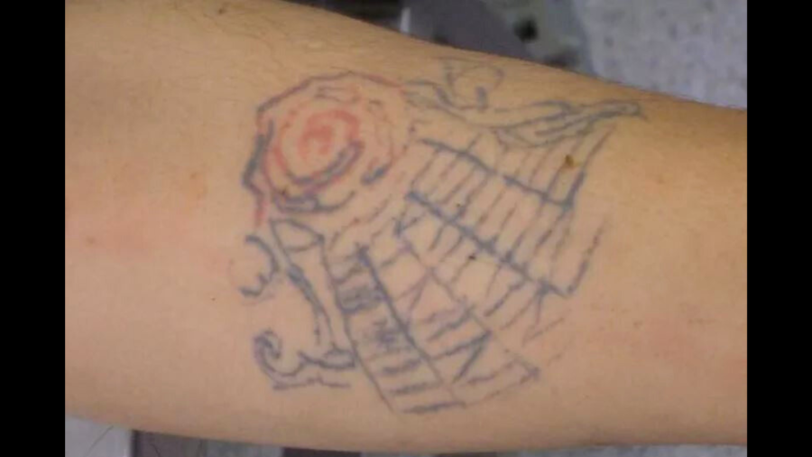 A rose stem tattoo is seen on the woman's left forearm. (Orange County Sheriff’s Department)