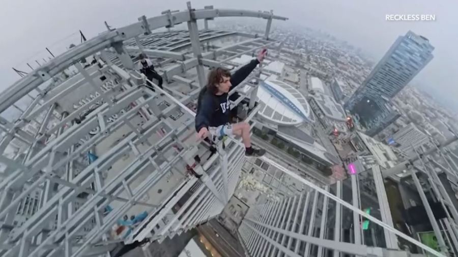 YouTube daredevil and performance artist Ben Schneider is seen walking a small rope tied between two skyscrapers in downtown Los Angeles on May 12, 2024. (Ben Schneider)