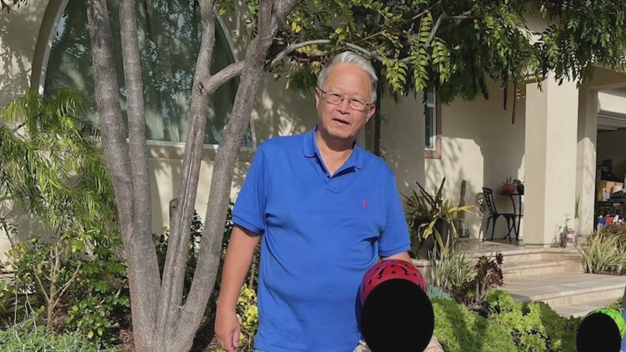 Allen Lee, 67, seen with his grandchild in a family photo.