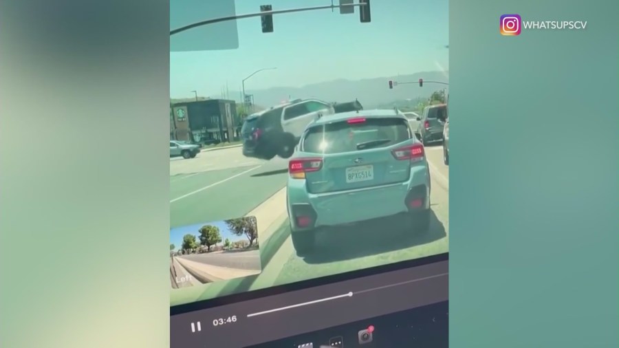 Dashcam video captured the moment a crash sent a deputy's vehicle barreling into a busy intersection in Santa Clarita on May 29, 2024. (@whatsupscv)