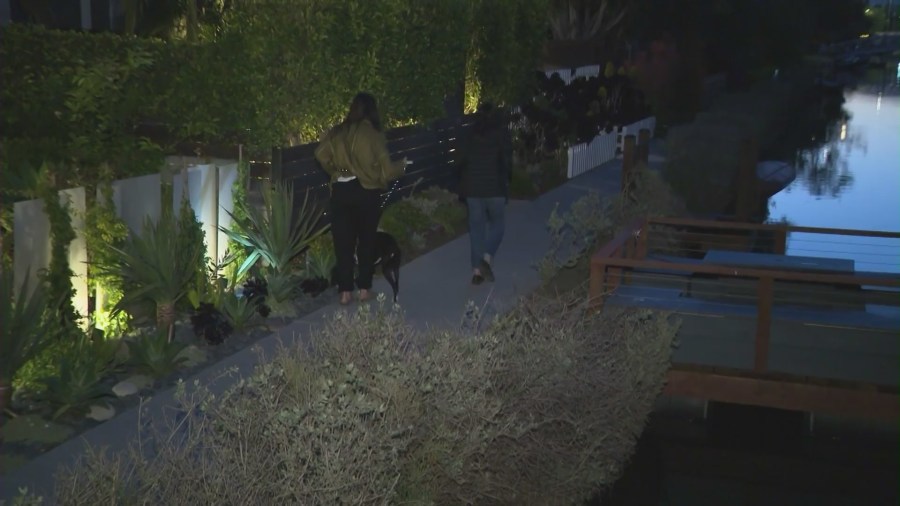 Residents walking along the Venice canals in California. (KTLA)