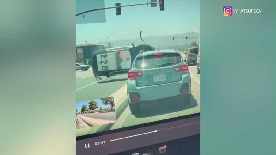 Dashcam video captured the moment a crash sent a deputy's vehicle barreling into a busy intersection in Santa Clarita on May 29, 2024. (@whatsupscv)