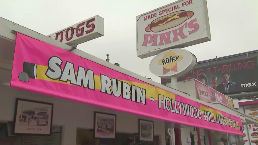 Pink's Hot Dogs honors Sam Rubin with custom banner outside their shop on North La Brea Avenue. (KTLA)