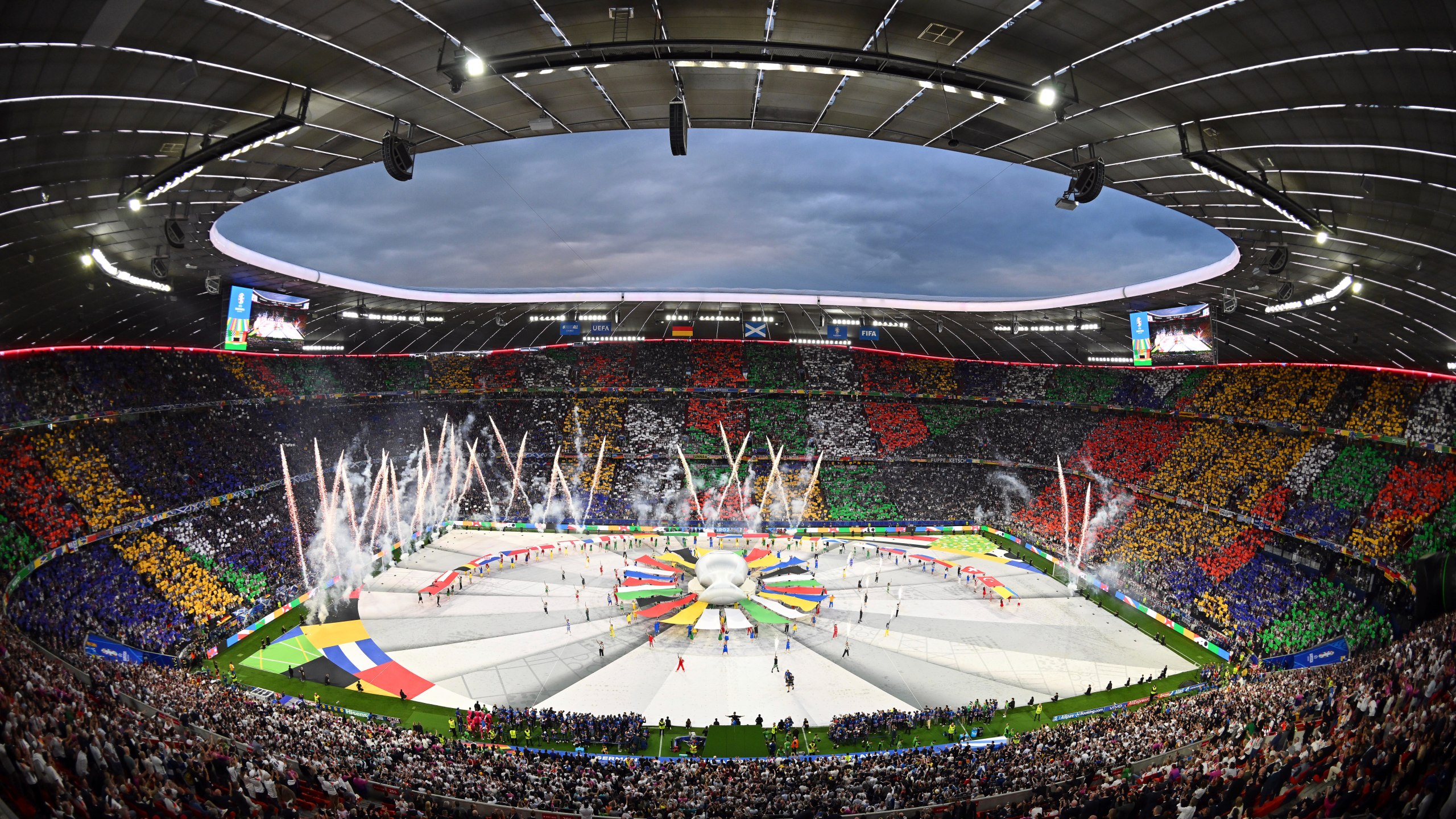 FILE - Dancers perform during the opening ceremony ahead of the Group A match between Germany and Scotland at the Euro 2024 soccer tournament in Munich, Germany, Friday, June 14, 2024. A German YouTuber says he made it onto the field during the European Championship opening ceremony while disguised in a mascot costume. Marvin Wildhage has published a video appearing to show how he entered the stadium in a fake costume and danced on the corner of the field during the ceremony before being led away by a UEFA staff member. (Peter Kneffel/dpa via AP, File)