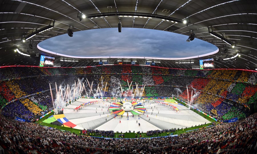 FILE - Dancers perform during the opening ceremony ahead of the Group A match between Germany and Scotland at the Euro 2024 soccer tournament in Munich, Germany, Friday, June 14, 2024. A German YouTuber says he made it onto the field during the European Championship opening ceremony while disguised in a mascot costume. Marvin Wildhage has published a video appearing to show how he entered the stadium in a fake costume and danced on the corner of the field during the ceremony before being led away by a UEFA staff member. (Peter Kneffel/dpa via AP, File)