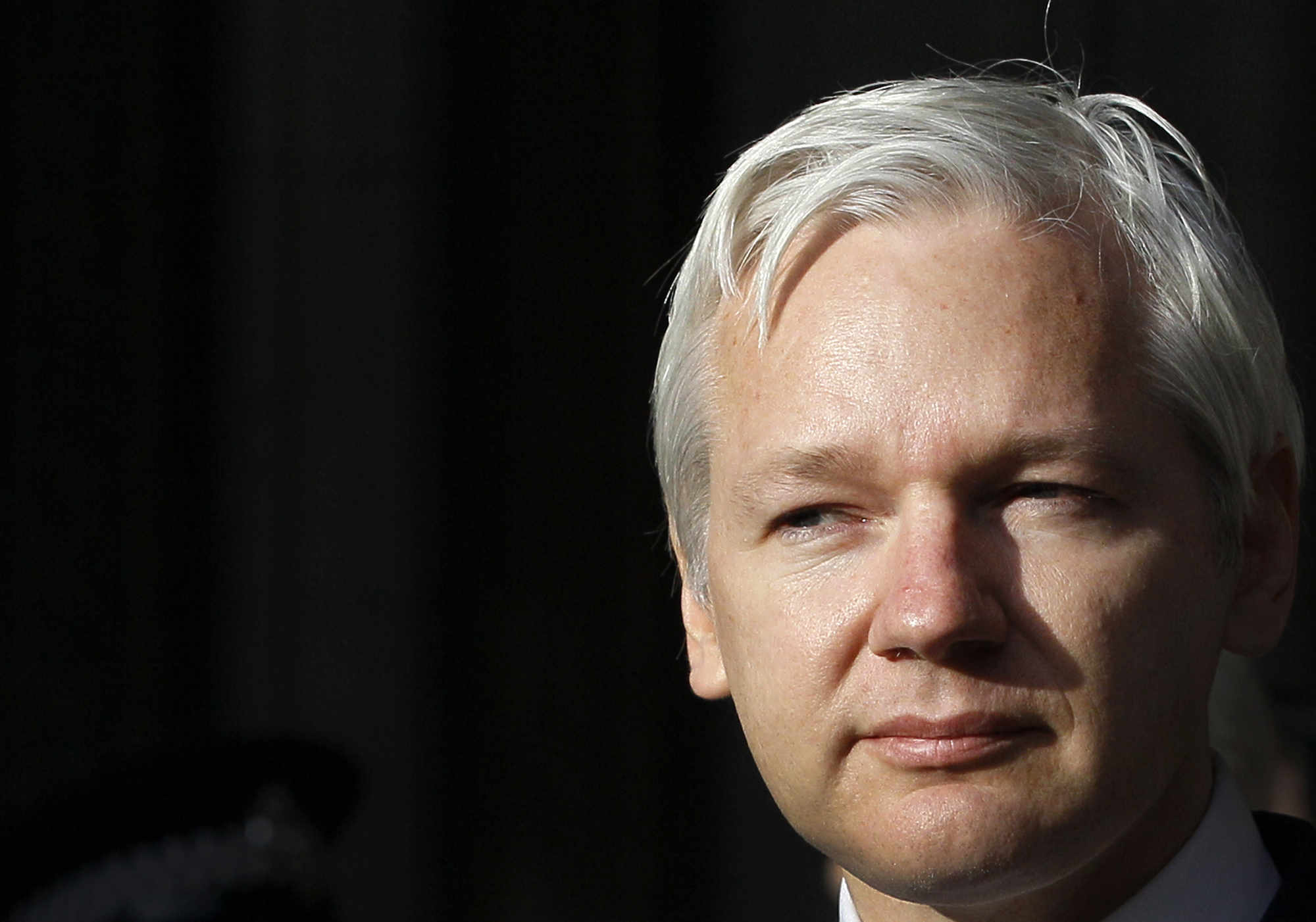 FILE - WikiLeaks founder Julian Assange pauses as he makes a statement to media gathered outside the High Court in London, on Dec. 5, 2011. (AP Photo/Kirsty Wigglesworth, File)