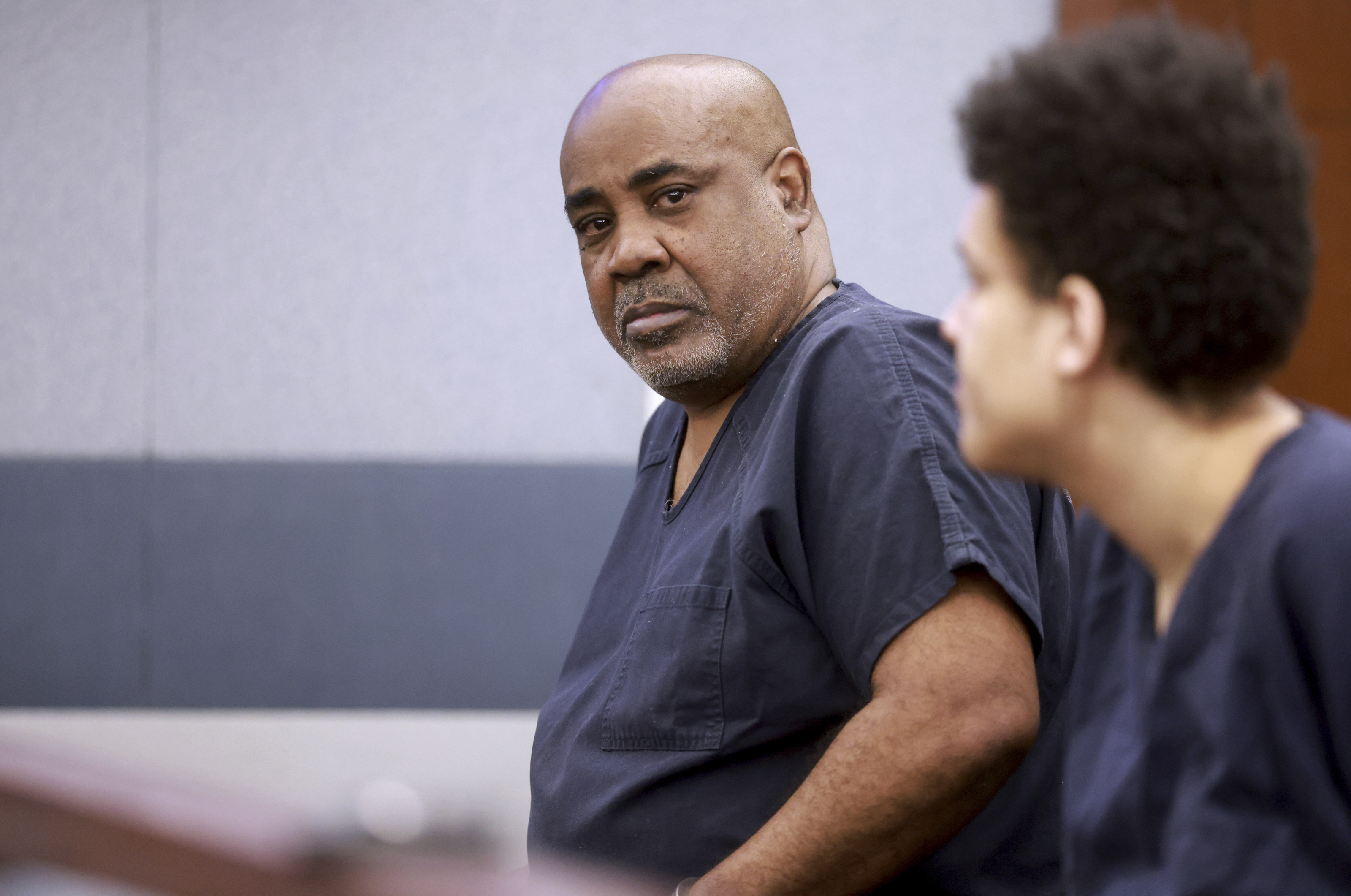 Duane "Keffe D" Davis, who is accused of orchestrating the 1996 slaying of hip-hop icon Tupac Shakur, center, waits to appear in court at the Regional Justice Center in Las Vegas, Tuesday, June 25, 2024. (K.M. Cannon/Las Vegas Review-Journal via AP, Pool)