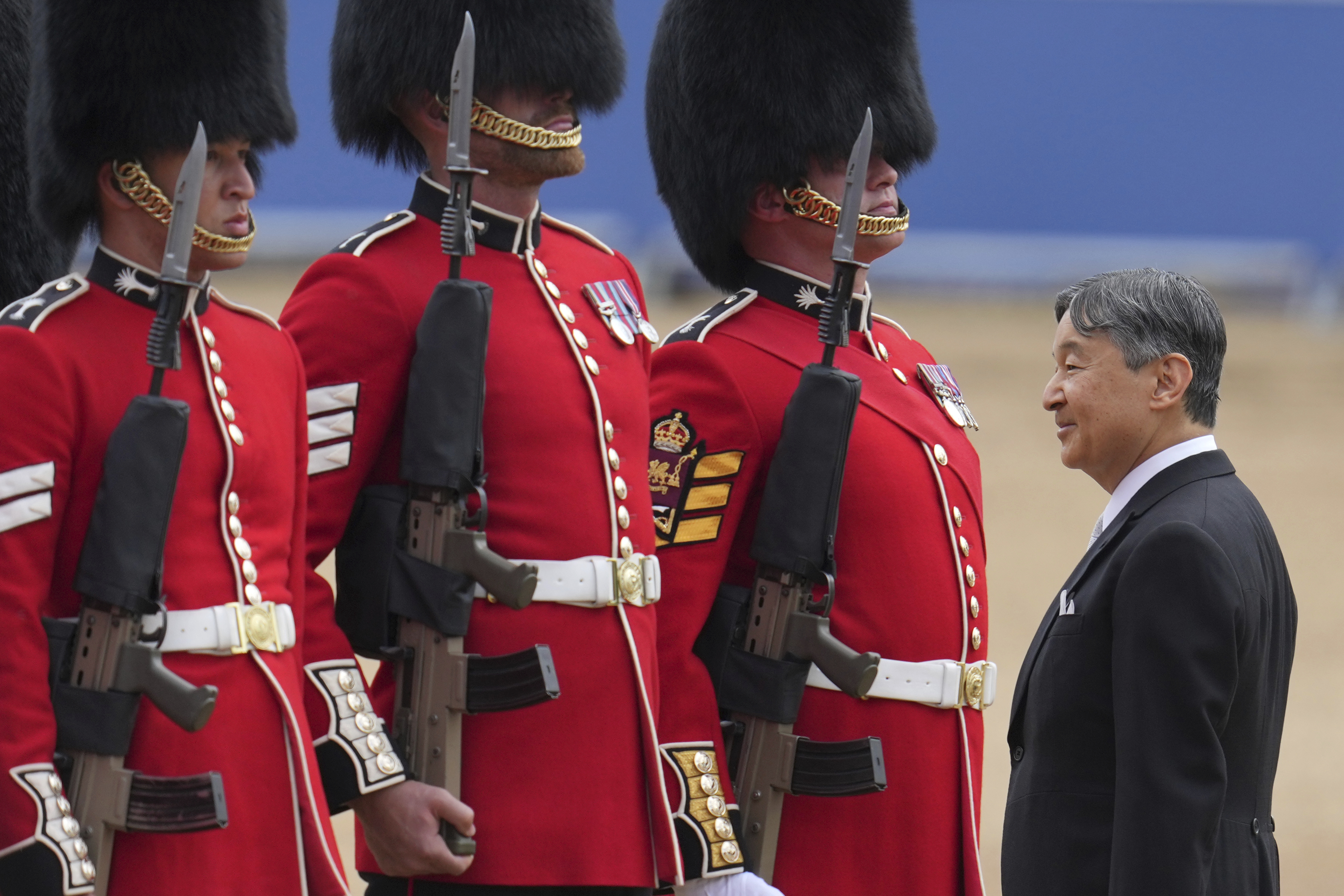 Japans Emperor Naruhito inspects the honour guard on Horse Guards parade during the ceremonial welcome for start of the State Visit to Britain by the Japanese Emperor and Empress, in London, Tuesday, June 25, 2024. (AP Photo/Kin Cheung, Pool)