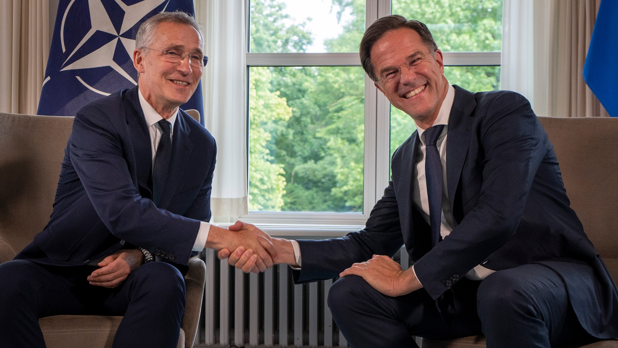 FILE - NATO Secretary General Jens Stoltenberg, left, and Dutch Prime Minister Mark Rutte shake hands for the cameras prior to a meeting in The Hague, Netherlands, Tuesday, June 27, 2023. NATO on Wednesday, June 26, 2024 appointed Mark Rutte as its next secretary-general, putting the outgoing Dutch prime minister in charge of the world's biggest security organization at a critical time for European security as war rages in Ukraine. (AP Photo/Peter Dejong, File)