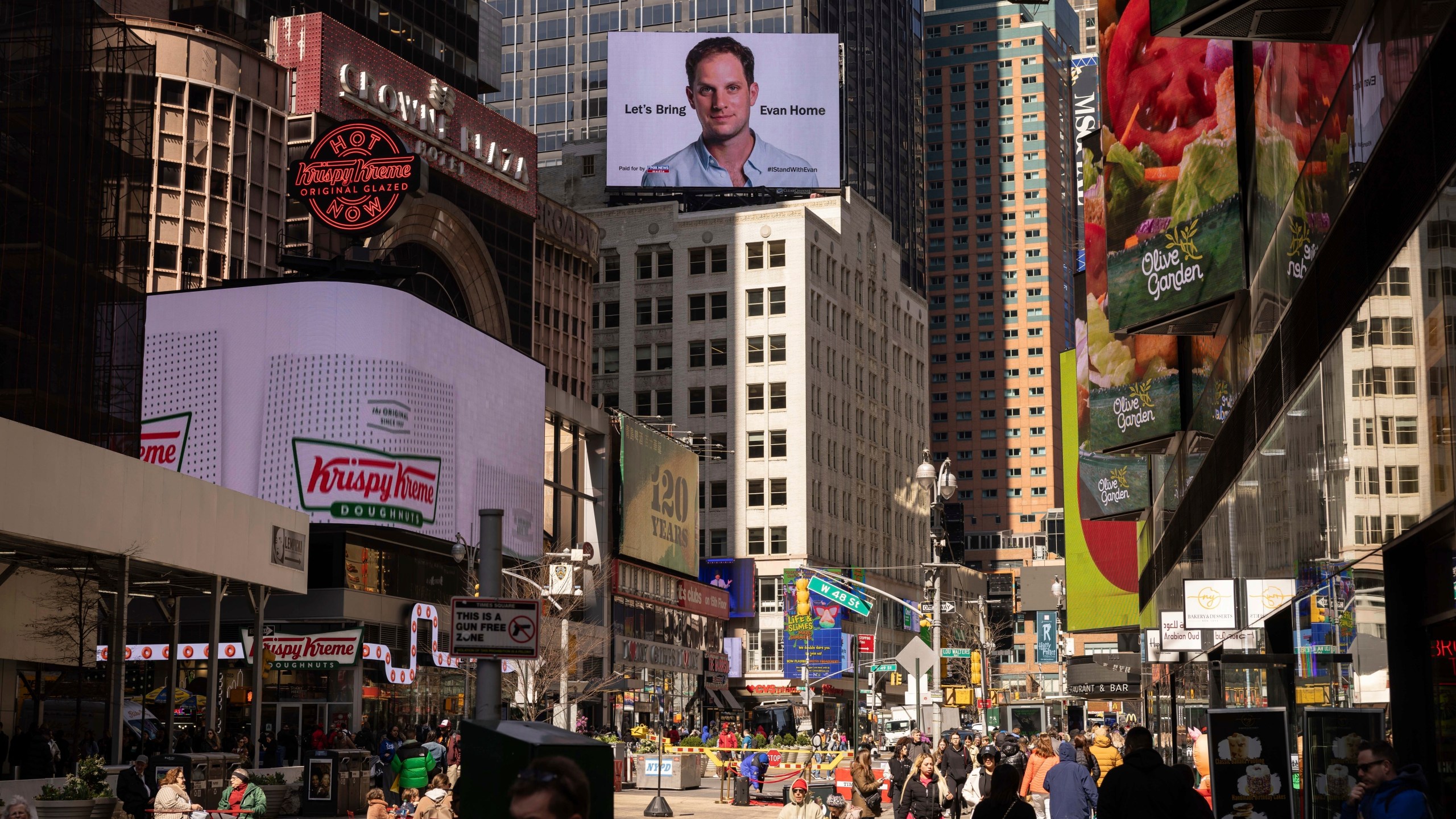 FILE - A billboard calling for the release of Wall Street Journal reporter Evan Gershkovich is seen in New York’s Times square on the first anniversary of his jailing in Russia, on March. 29, 2024. Fifteen months after he was arrested in the city of Yekaterinburg on espionage charges, Gershkovich returns there for his trial starting Wednesday, June 26, 2024. Gershkovich, his employer and the U.S. government deny the charges. (AP Photo/Yuki Iwamura, File)