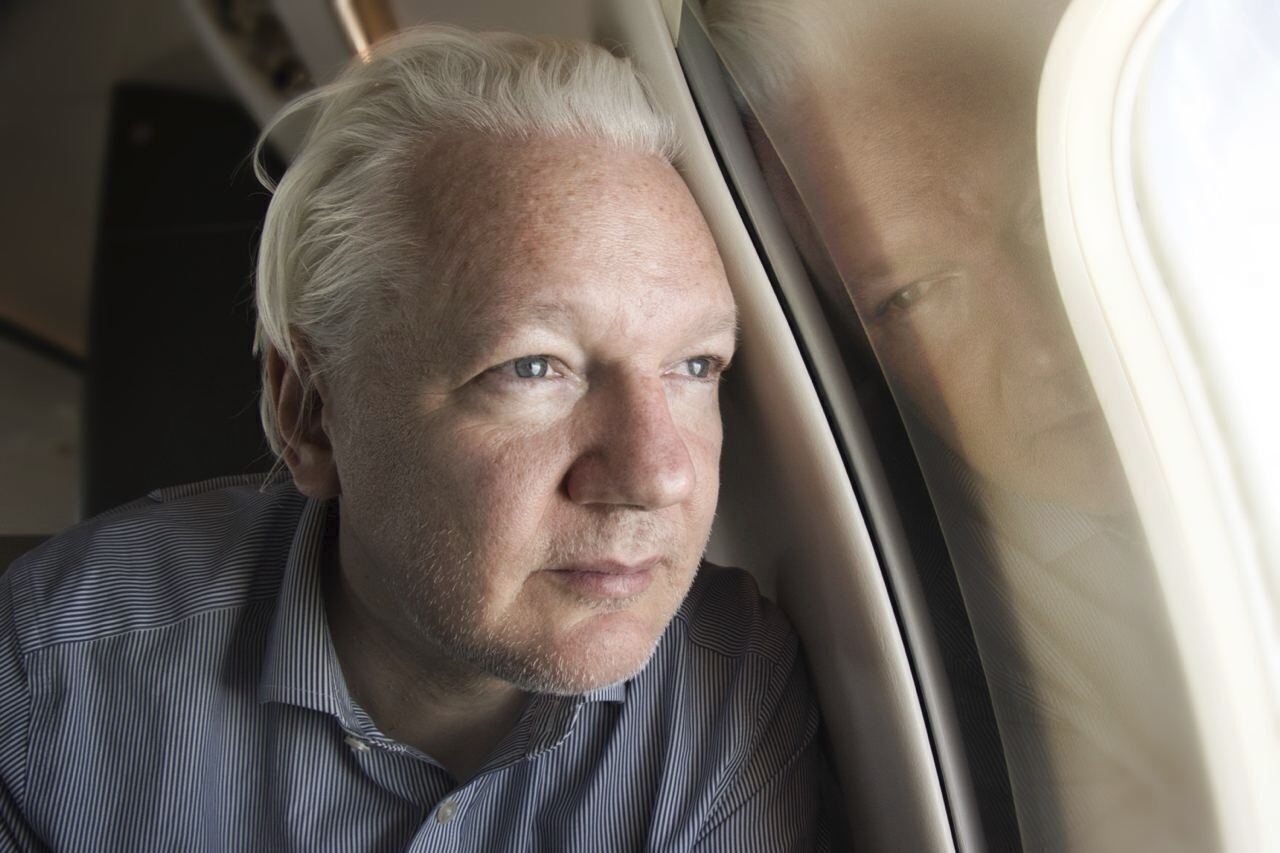 FILE - This screen grab from the X account of Wikileaks shows Julian Assange on board a flight to Bangkok, Thailand, following his release from prison on Tuesday June 25, 2024. The abrupt guilty plea by WikiLeaks founder Julian Assange was the culmination of negotiations that began a year and a half ago and accelerated in recent months.(@WikiLeaks, via AP)