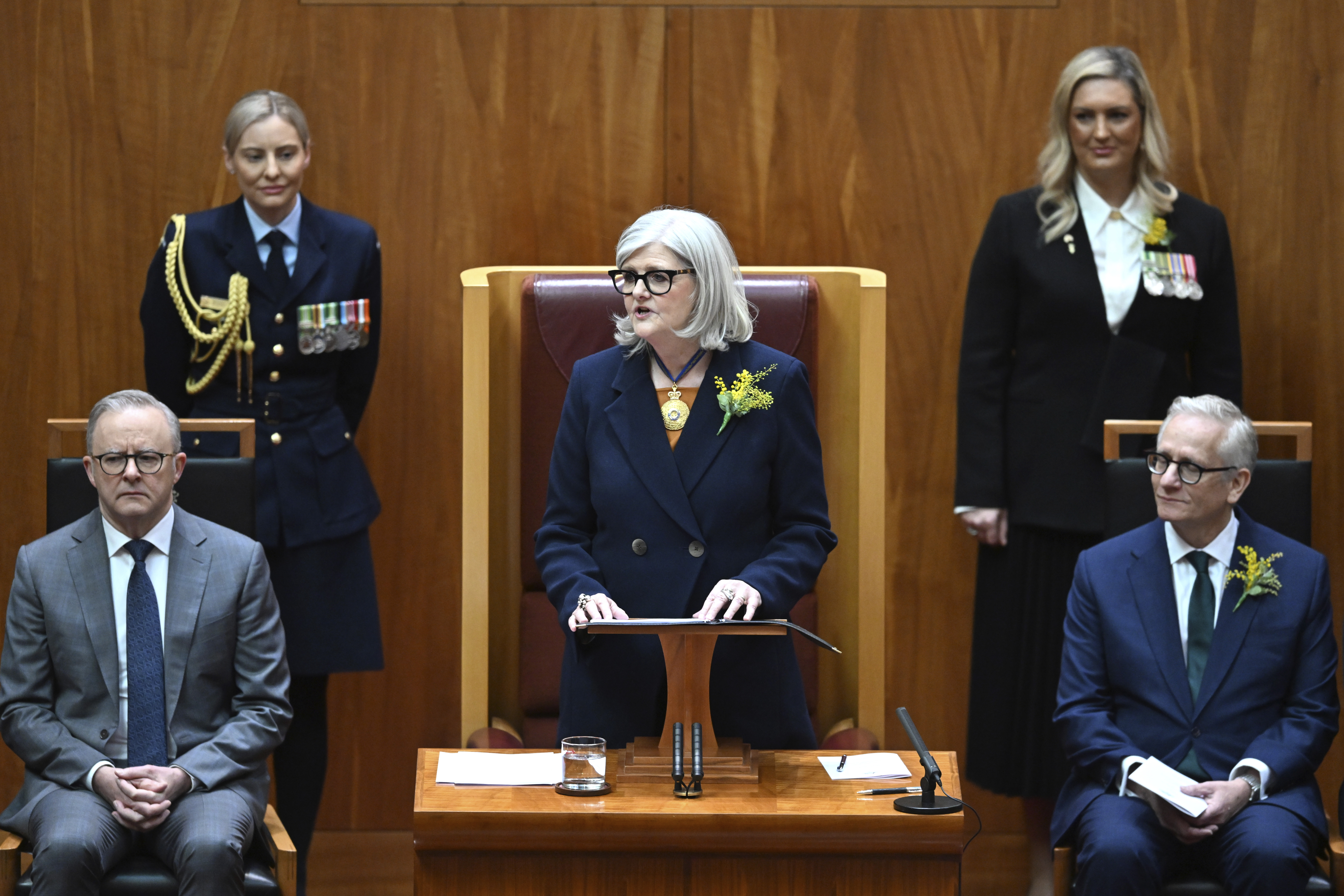 Governor-General of Australia Sam Mostyn, center, speaks during the swearing in ceremony in the Senate chamber at Parliament House in Canberra, Monday, July 1, 2024, as Prime Minister Anthony Albanese, left, listens. Mostyn is Australia's second woman governor-general, a largely ceremonial role representing the British monarch as the nation's head of state. (Lukas Coch/AAP Image via AP)