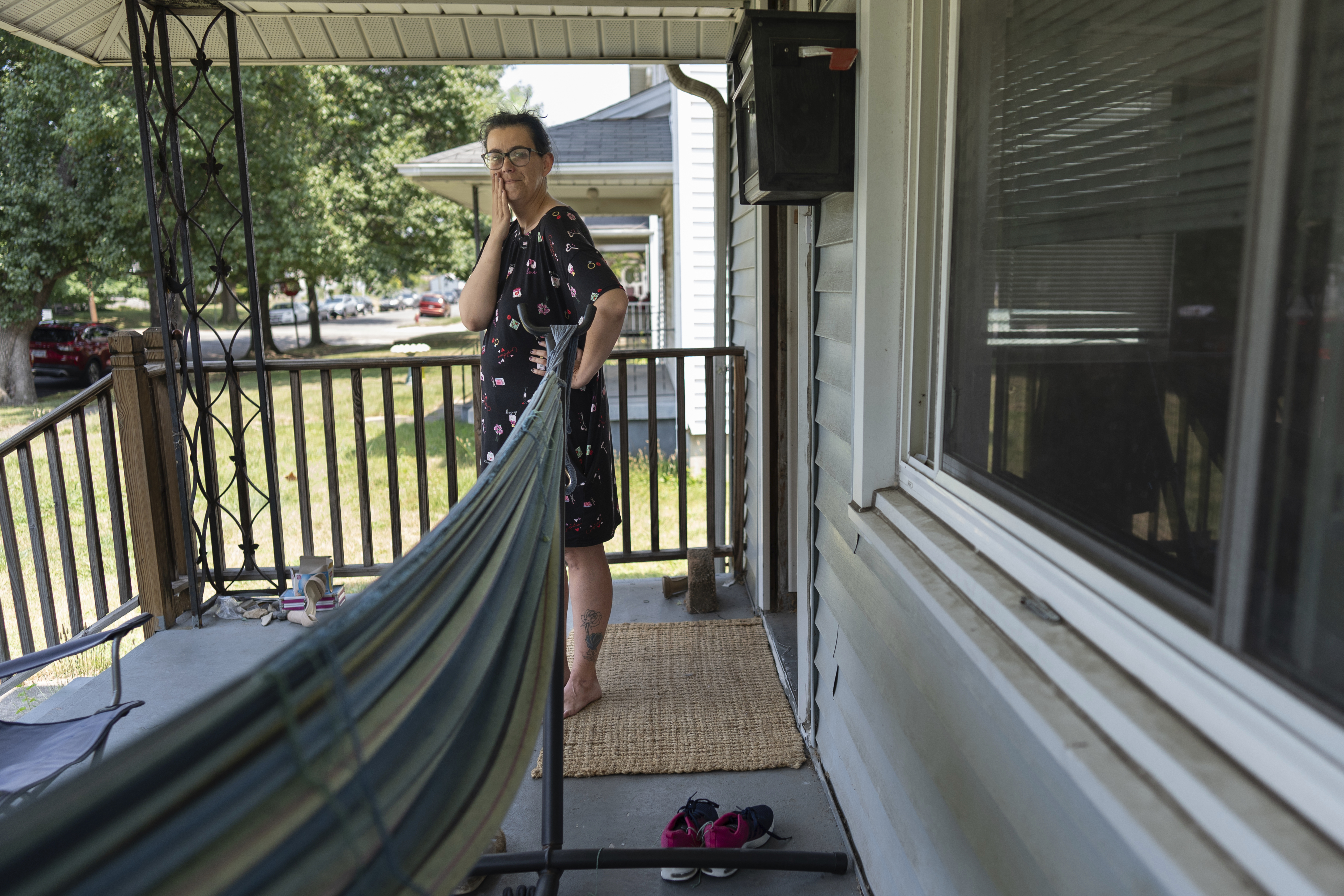 Amanda Bailey, 35, stands on her front porch on Friday, June 21, 2024, in Middletown, Ohio. This house, where Bailey and her family live, is the same house where “Hillbilly Elegy” author Sen. J.D. Vance, R-Ohio, grew up. Bailey said she thought “Hillbilly Elegy” nailed it, and that former President Donald Trump and Vance would “make a great team.” (AP Photo/Carolyn Kaster)