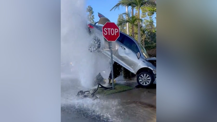 Crash in SoCal leaves car suspended by gushing water