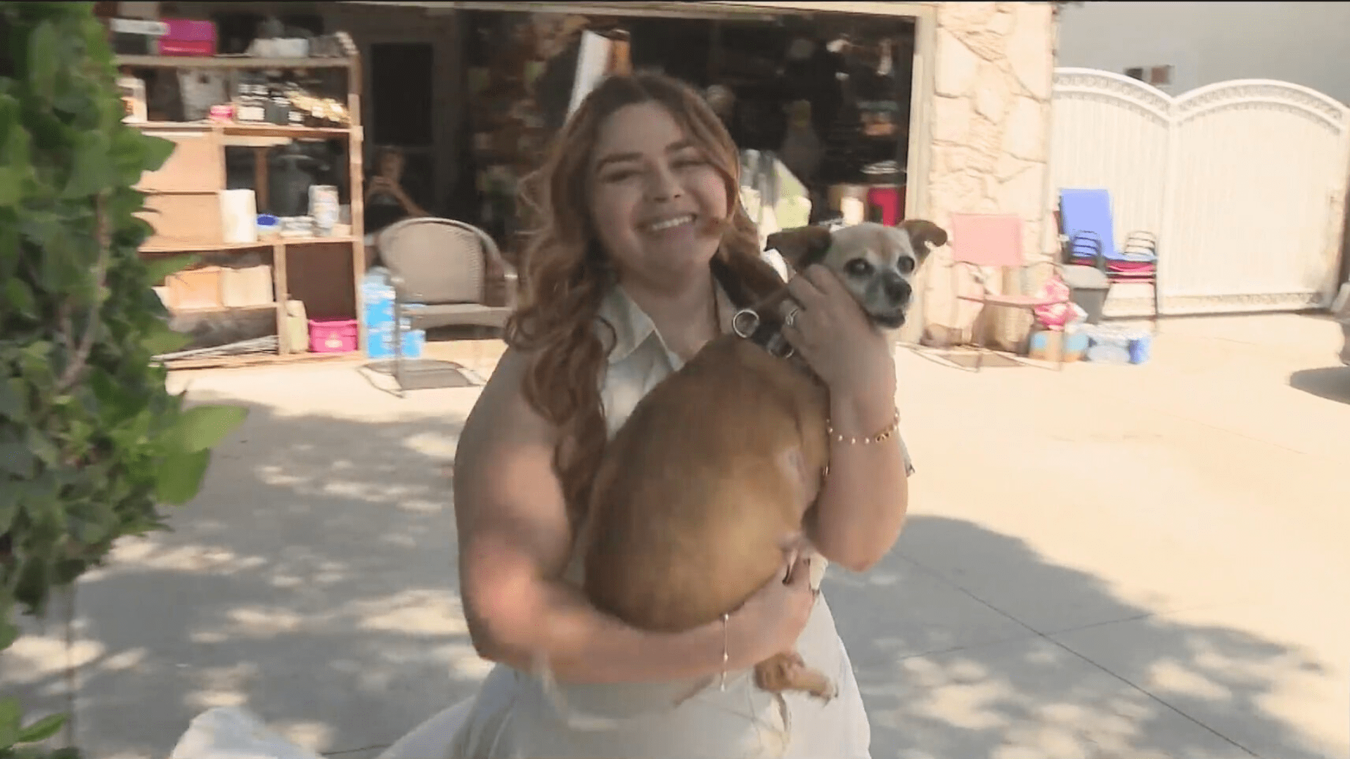 Amy Robbins and her dog, Abbey, are seen outside their Anaheim home as Abbey recovers on June 22, 2024. (KTLA)