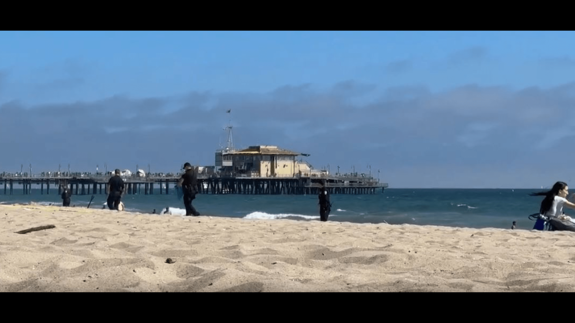 One person was stabbed and another injured after a large brawl broke out on the beach near the Santa Monica Pier on June 29, 2024. (TNLA)