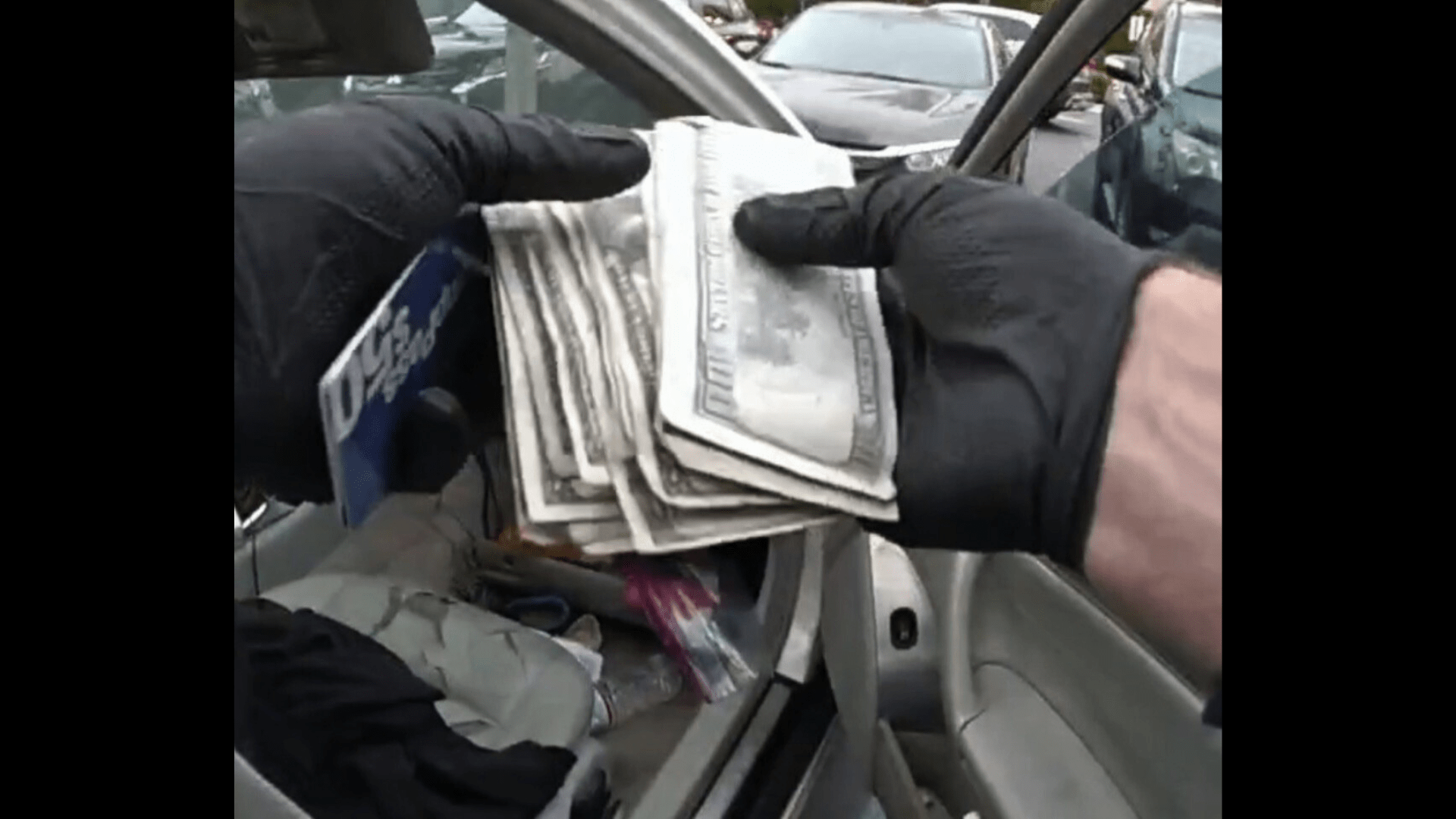 Police found over $2,700 in counterfeit money along with stolen mail and credit cards inside the suspect's stolen car. (Irvine Police Department)