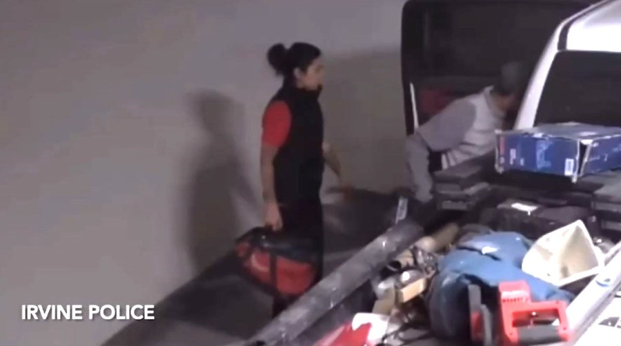 A woman and man seen stealing tools from a pickup truck at an Irvine apartment complex on June 2, 2024. (Irvine Police Department)