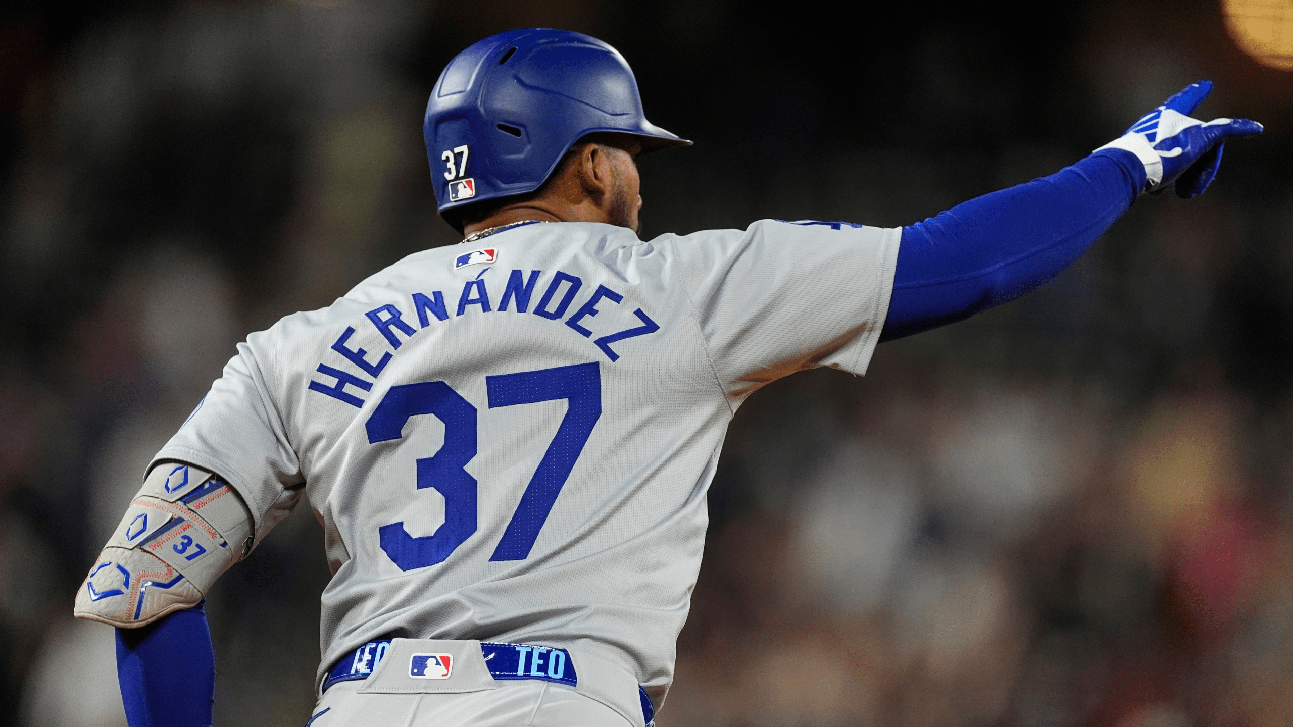 Dodgers' Teoscar Hernández gestures after hitting a three-run home run