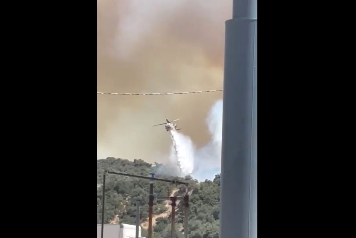 Helicopters dropping water on the Post Fire burning near the 5 Freeway in Gorman on June 15, 2024. (Erika Layton-Reynolds)