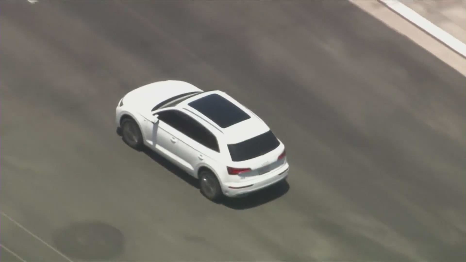 The suspects' white Audi SUV led police officers on a lengthy pursuit through L.A. and Orange counties on June 26, 2024. (KTLA)