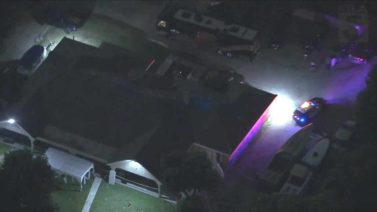 Authorities scour a Compton home after a party shooting left one person dead and four others hospitalized on June 7, 2024. (KTLA)