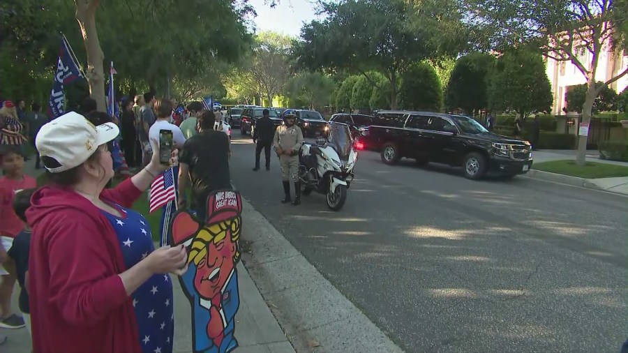 Supporters waiting outside as Donald Trump's motorcade arrives at a Beverly Hills home for a campaign fundrasiing event on June, 7, 2024. (KTLA)