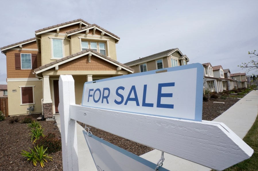 A for sale sign is posted in front of a home in Sacramento.