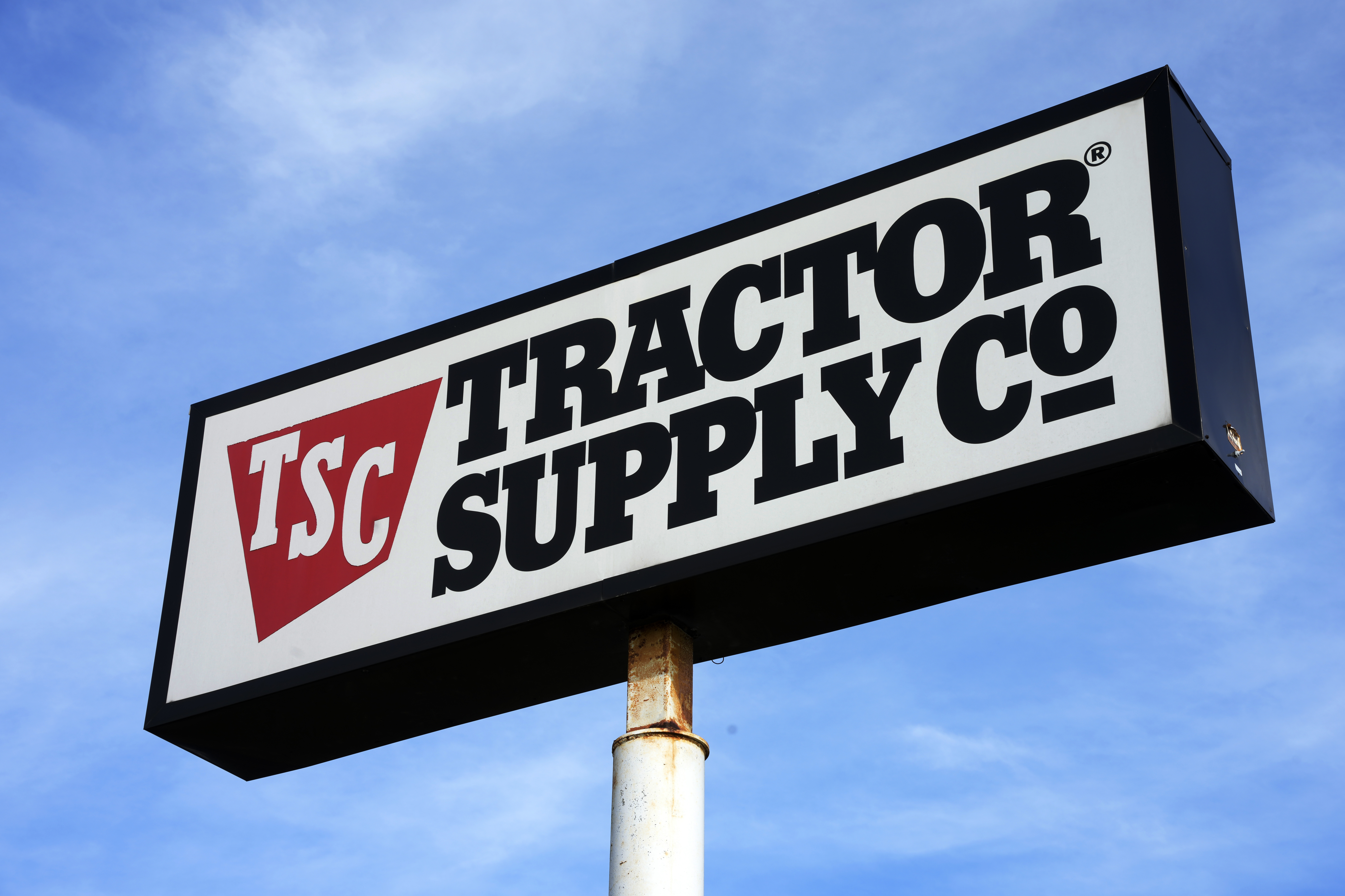 FILE - A Tractor Supply Company store sign is seen, Feb. 2, 2023, in Pittsburgh. The National Black Farmers Association is calling on Tractor Supply's president and CEO to step down, days after the rural retailer announced that it would be dismantling an array of its corporate diversity and climate advocacy efforts. (AP Photo/Gene J. Puskar, File)