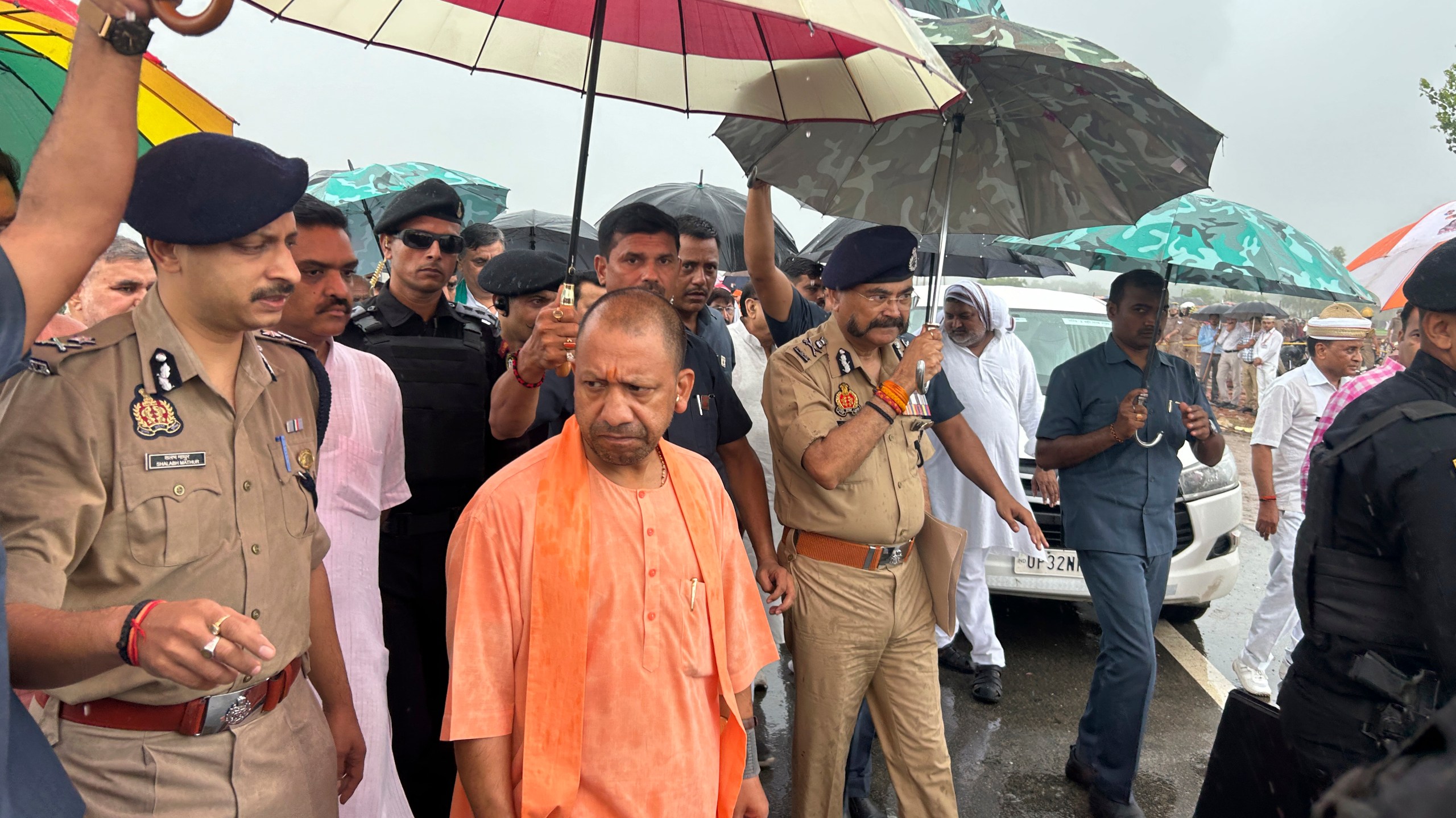 Uttar Pradesh State Chief Minister Yogi Adityanath visits the place where a fatal stampede took place in Fulrai village of Hathras district, Uttar Pradesh, India, Wednesday, July 3, 2024. Thousands of people at a religious gathering rushed to leave a makeshift tent, setting off a stampede Tuesday that killed more than hundred people and injured scores. (AP Photo/Rajesh Kumar Singh)