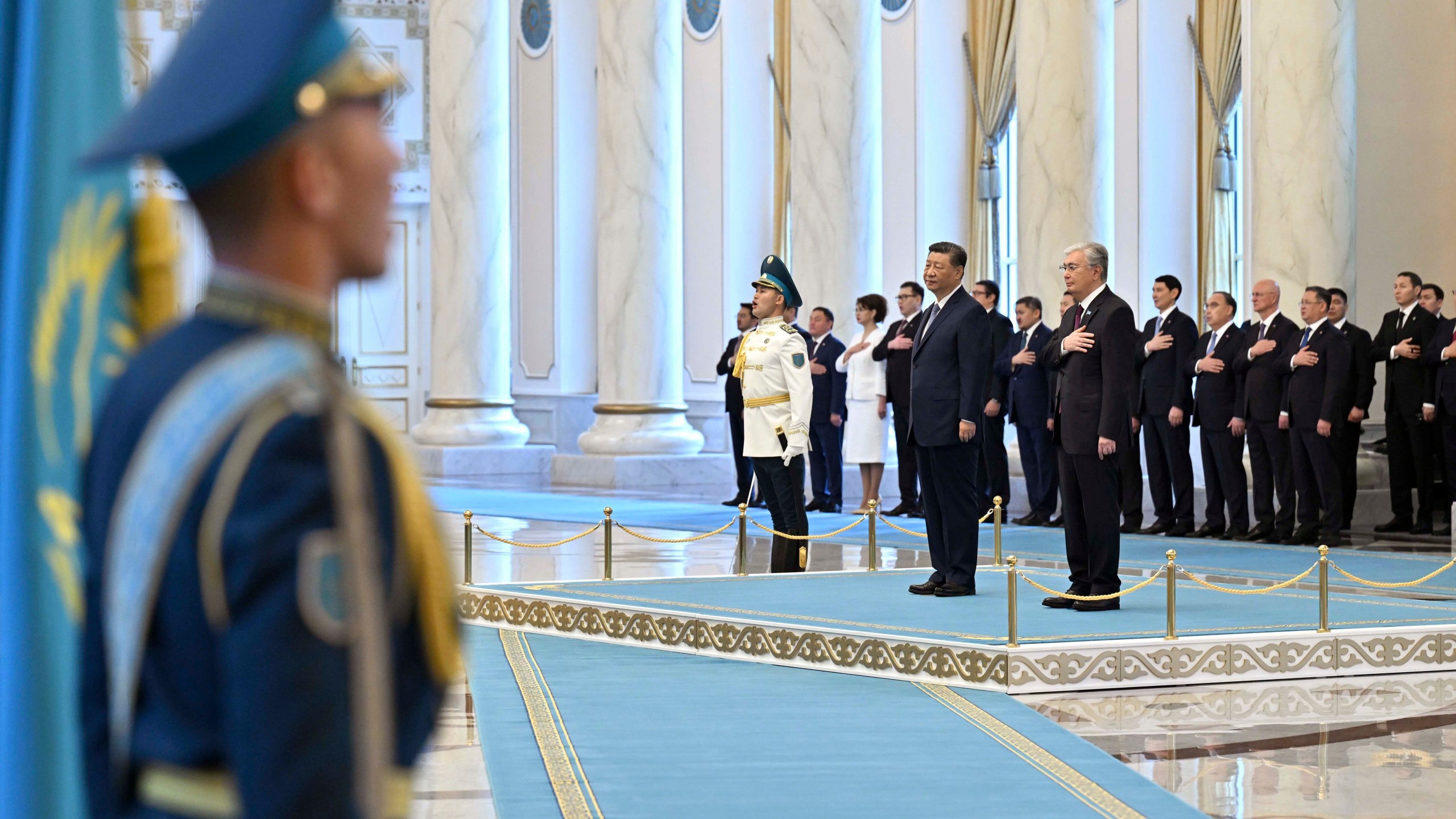 In this photo released by Kazakhstan's Presidential Press Office, President Kassym-Jomart Tokayev, right, and Chinese President Xi Jinping, second right, attend an official welcome ceremony at the palace in Astana, Kazakhstan, on Wednesday, July 3, 2024. (Kazakhstan's Presidential Press Office via AP)