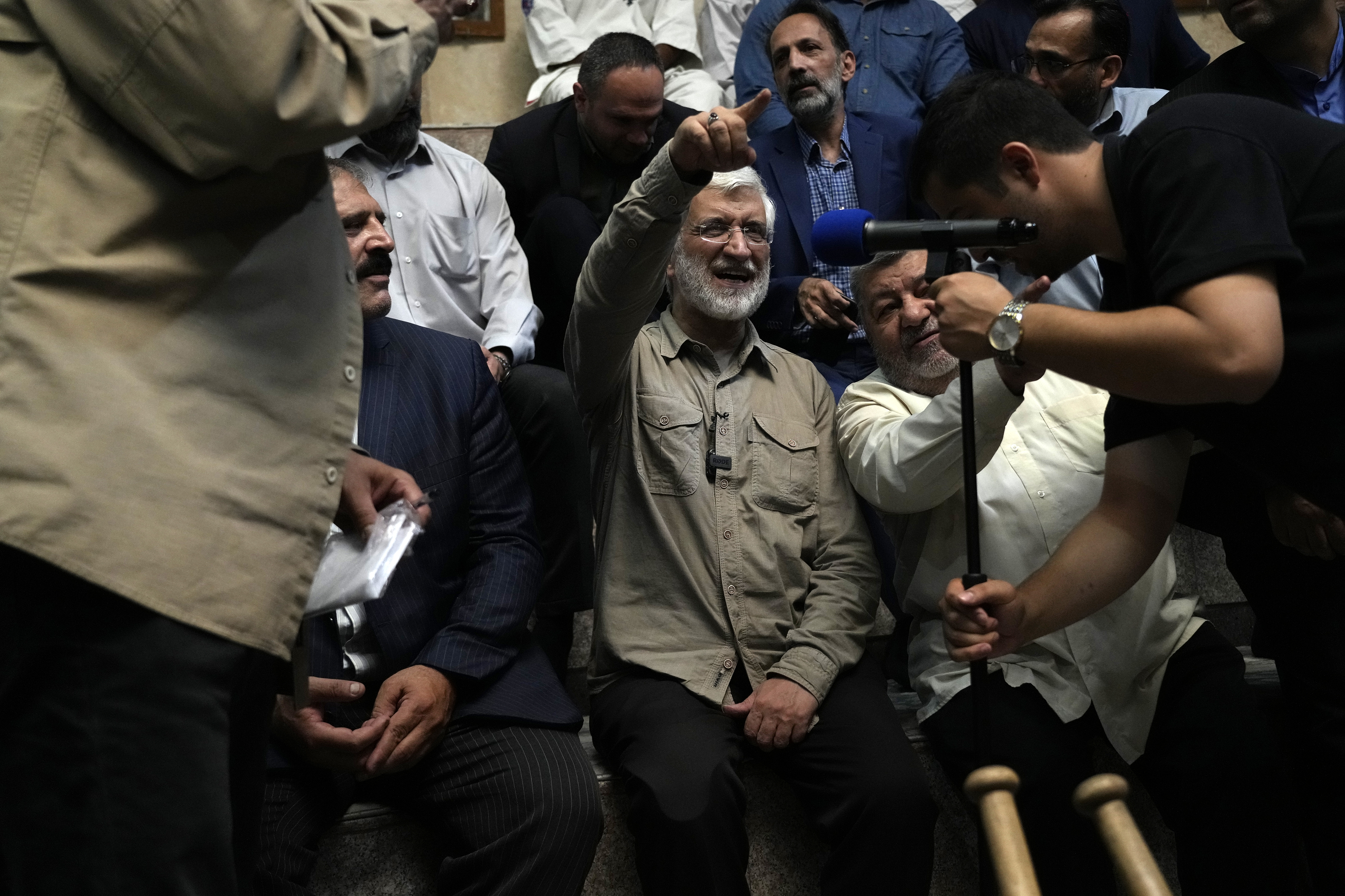 Candidate for the presidential election Saeed Jalili, a former Iranian top nuclear negotiator, gestures in a meeting with a group of athlete supporters at a sport hall in his campaigns in Tehran, Iran, Sunday, June 30, 2024. Comments suggesting that Iran's reformist presidential candidate could increase government-set gasoline prices have raised fears of a repeat of nationwide protests. (AP Photo/Vahid Salemi)