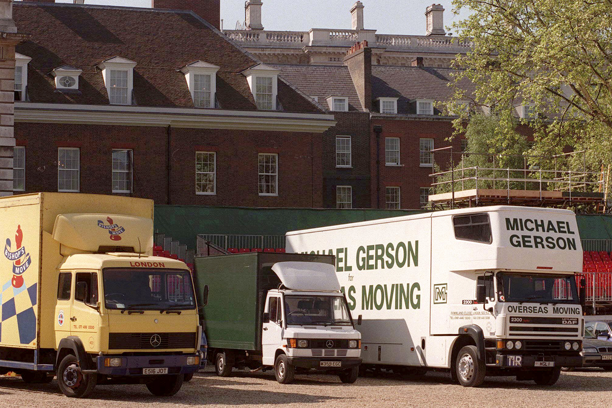 FILE - Removal vans line up at the rear of Downing Street after new Prime Minister Tony Blair replaced outgoing Conservative John Major, in London, on May 2 1997. (AP Photo/Jacqueline Arzt, File)