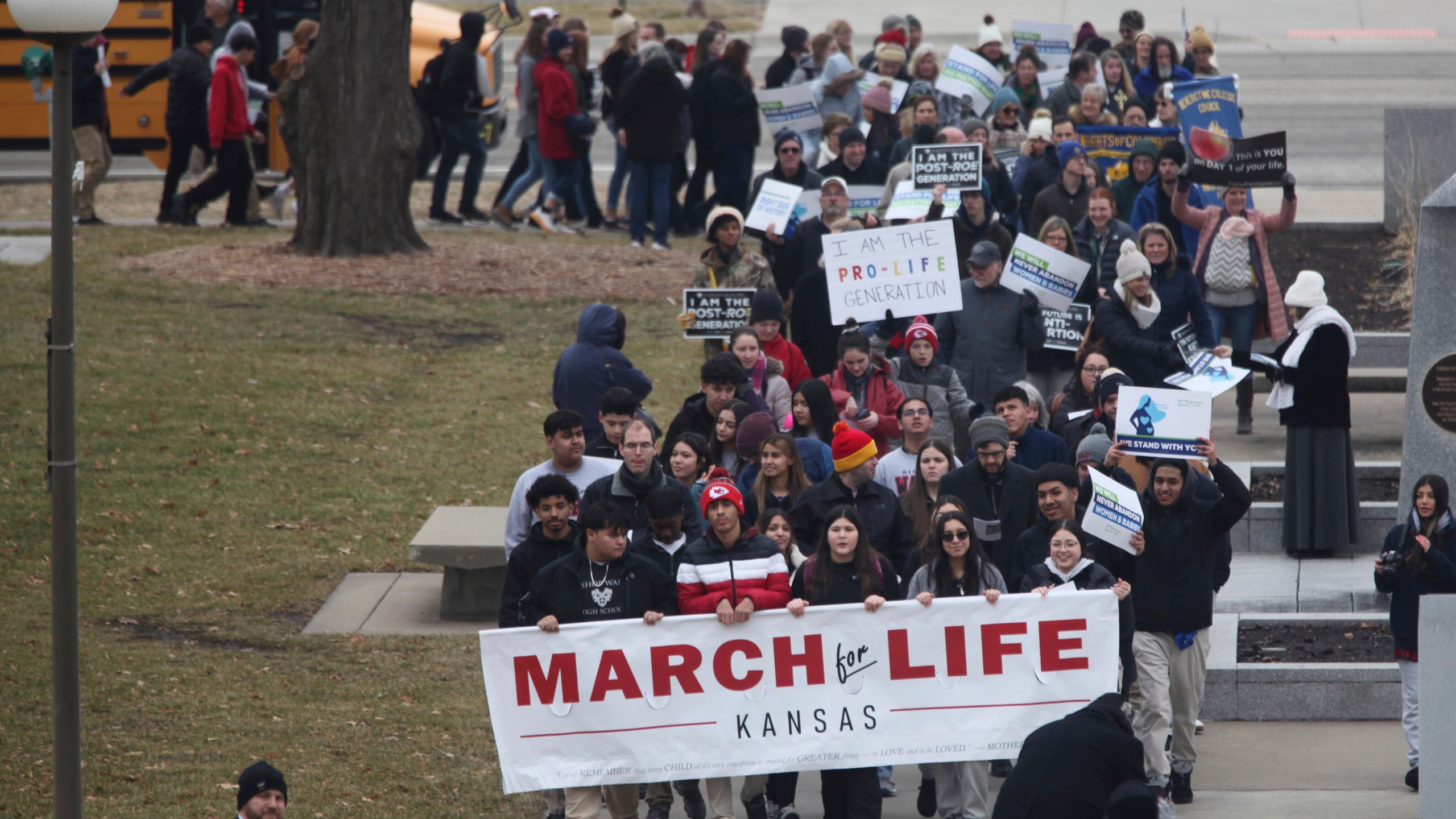 FILE - Some of the hundreds of abortion opponents and parochial school students participating in an anti-abortion rally march to the south steps of the Kansas Statehouse, Tuesday, Jan. 24, 2023, in Topeka, Kan. Kansas’ highest court on Friday, July 5, 2024, struck down state laws regulating abortion providers more strictly than other health care providers and banning a common second-trimester procedure, reaffirming its stance that the state constitution protects abortion access. (AP Photo/John Hanna, File)