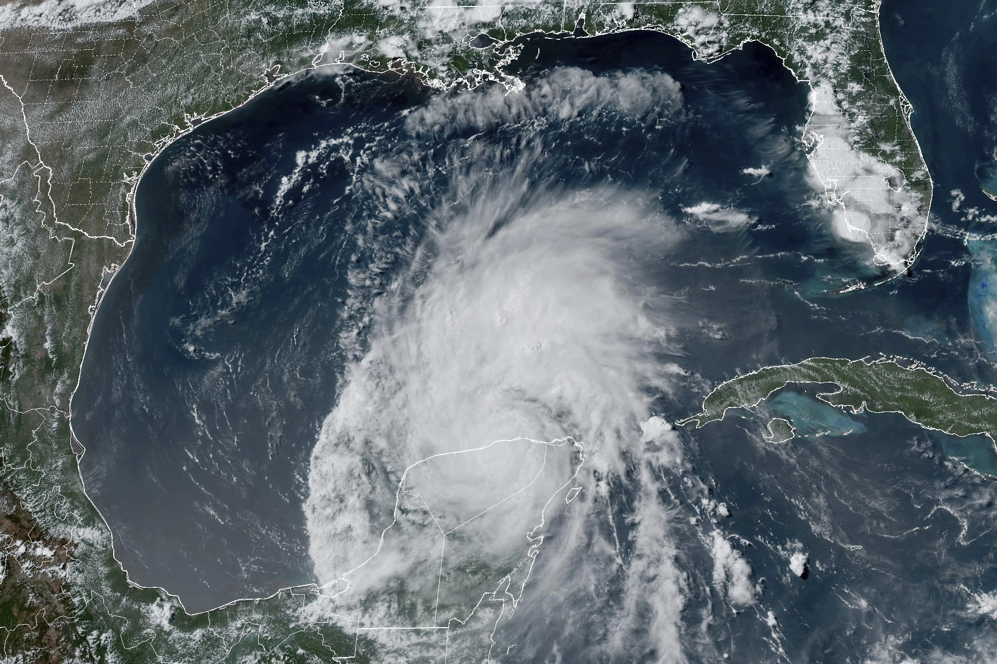 This GOES-16 GeoColor satellite image taken at 4:16 p.m. EDT on Friday, July 5, 2024, and provided by NOAA, shows Hurricane Beryl over Mexico’s Yucatan Peninsula. Texas officials urged coastal residents to prepare as the storm moves toward the Gulf of Mexico. (NOAA via AP)