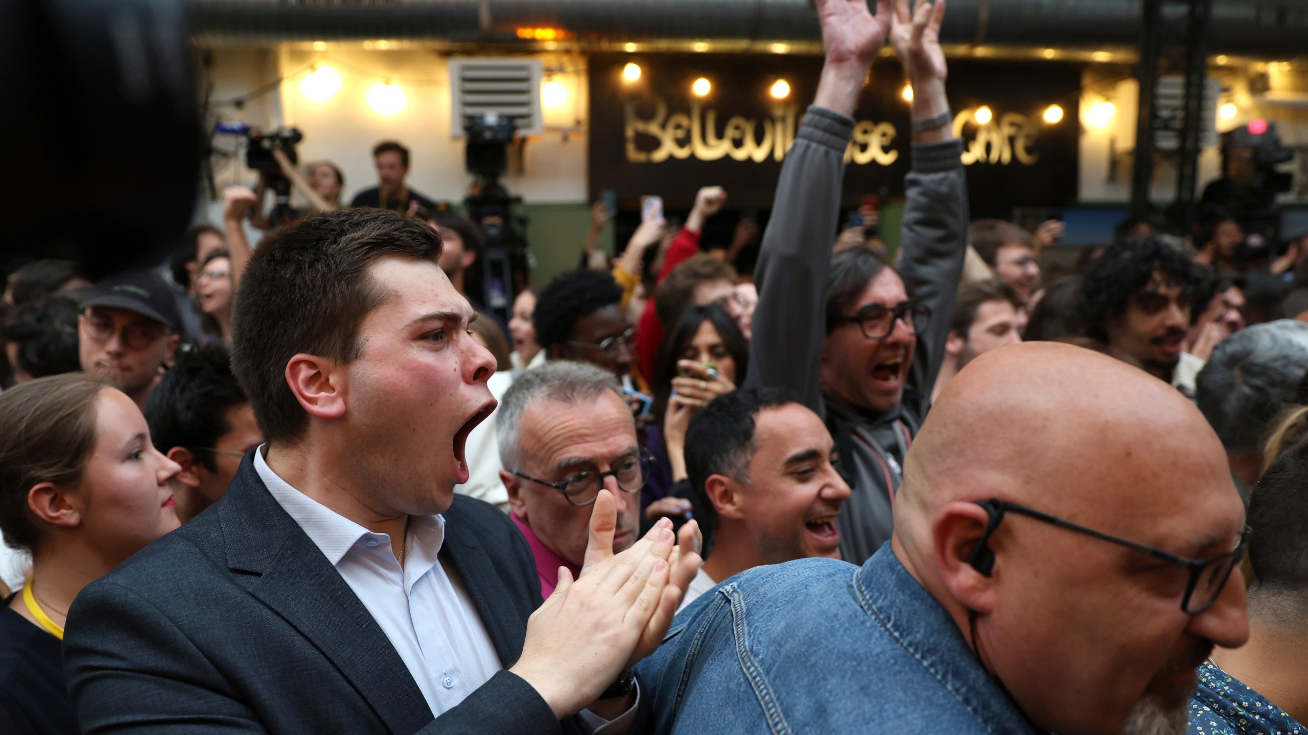 Supporters of the Socialist Party react after the second round of the legislative elections, Sunday, July 7, 2024 at their election night headquarters in Paris. A coalition on the left that came together unexpectedly ahead of France's snap elections won the most parliamentary seats in the vote, according to polling projections Sunday. The surprise projections put President Emmanuel Macron's centrist alliance in second and the far right in third. (AP Photo/Aurelien Morissard)