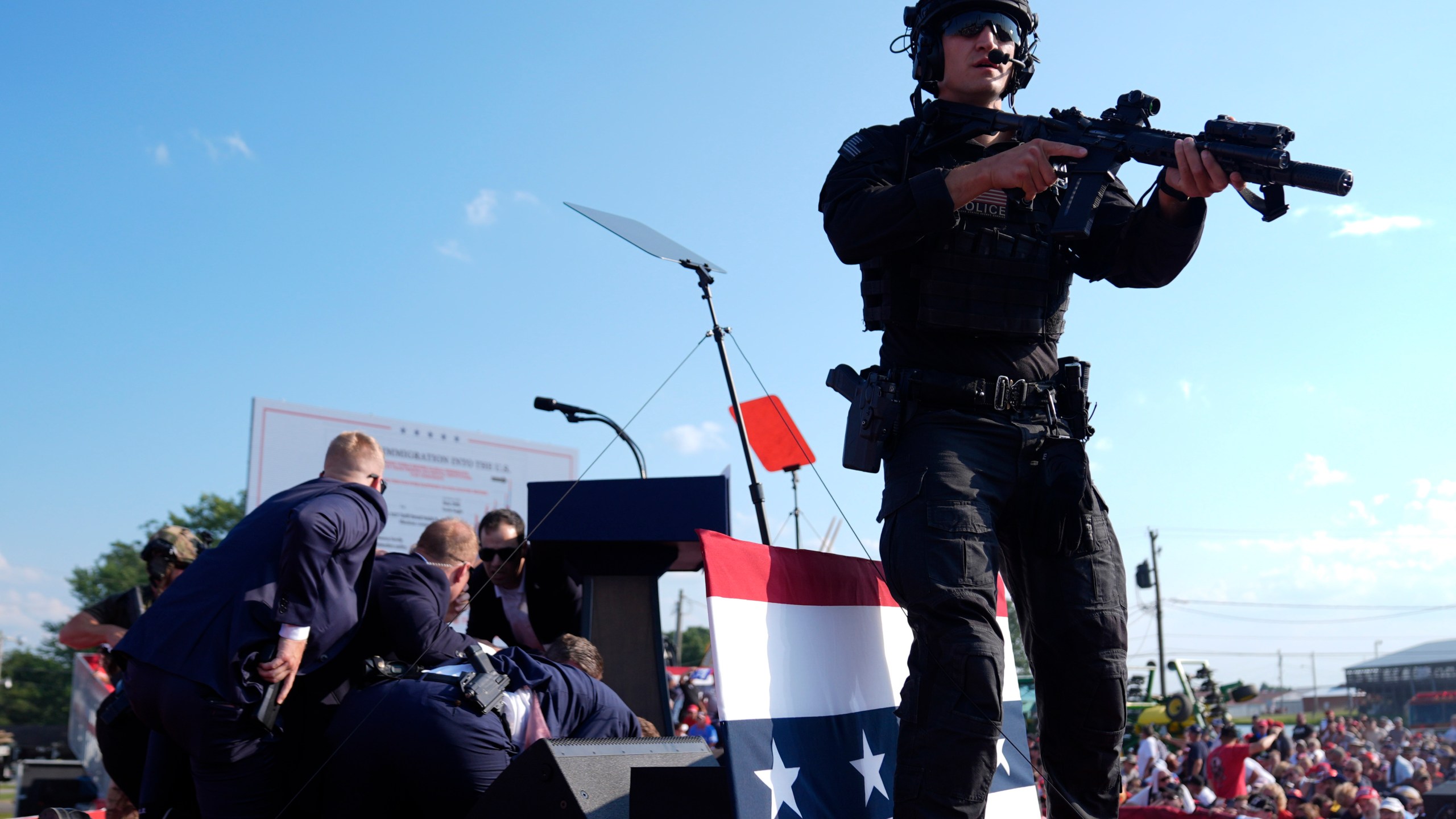 Republican presidential candidate former President Donald Trump is covered by U.S. Secret Service agents at a campaign rally, Saturday, July 13, 2024, in Butler, Pa. (AP Photo/Evan Vucci)