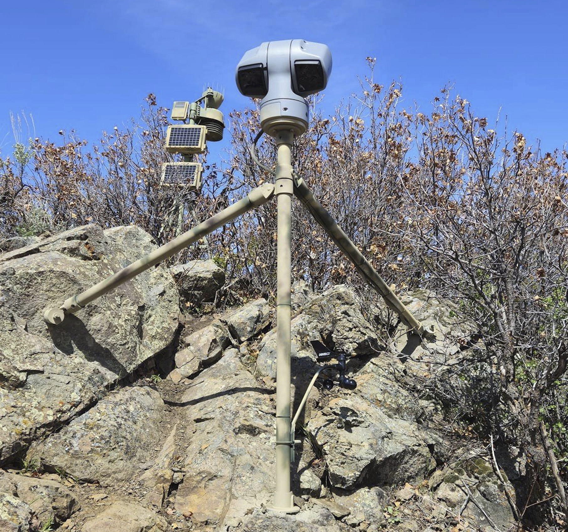 This image provided by Emily Taylor shows the weather station and camera setup, which are part of the Cal Poly research and community service initiative, Project RattleCam, in northern Colorado, in May 2024. The camera is live streaming a "mega den" of rattlesnakes. (Emily Taylor/Project RattleCam via AP)